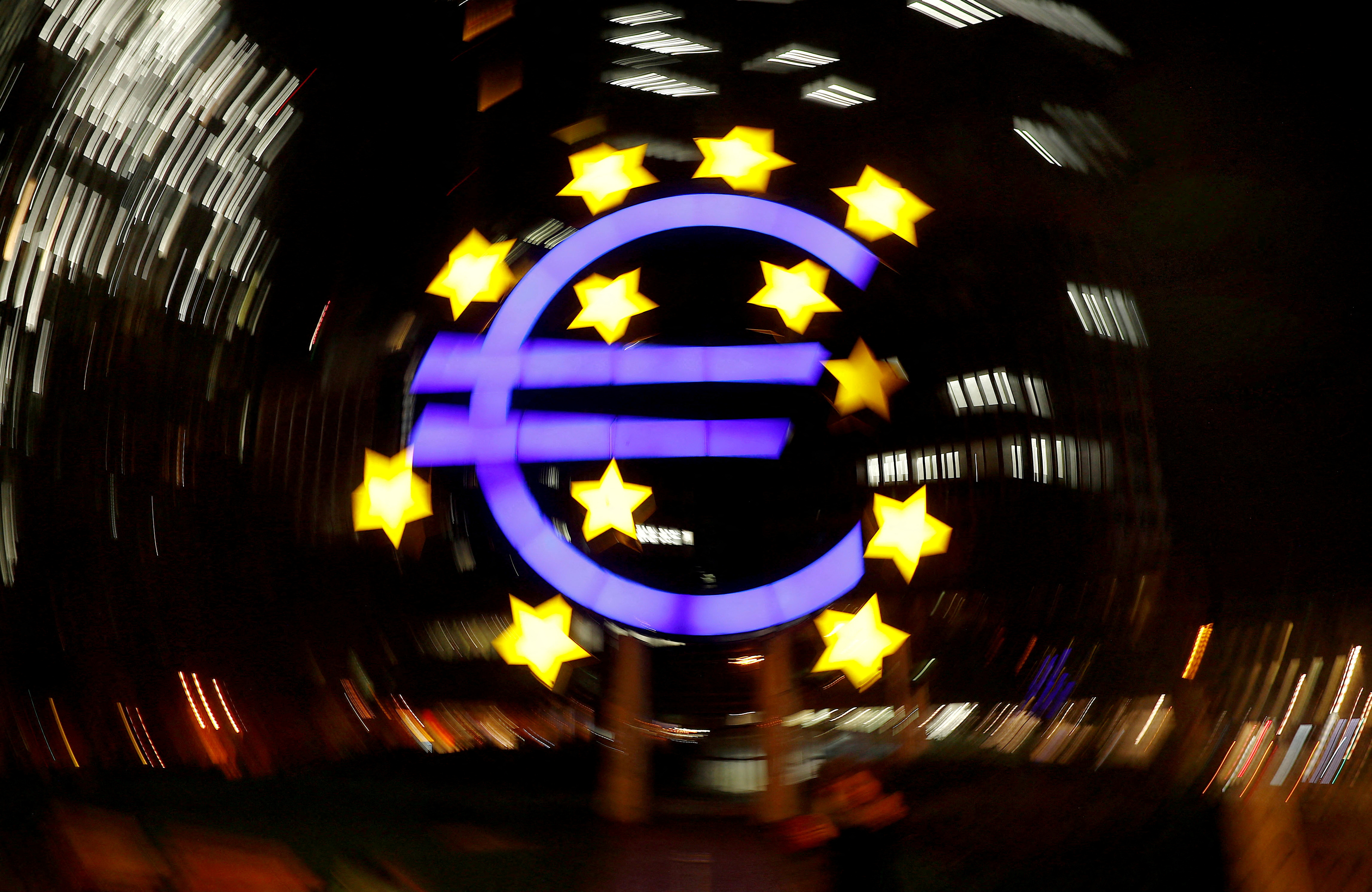 The euro sign is photographed in front of the former ECB headquarters of the European Central Bank in Frankfurt