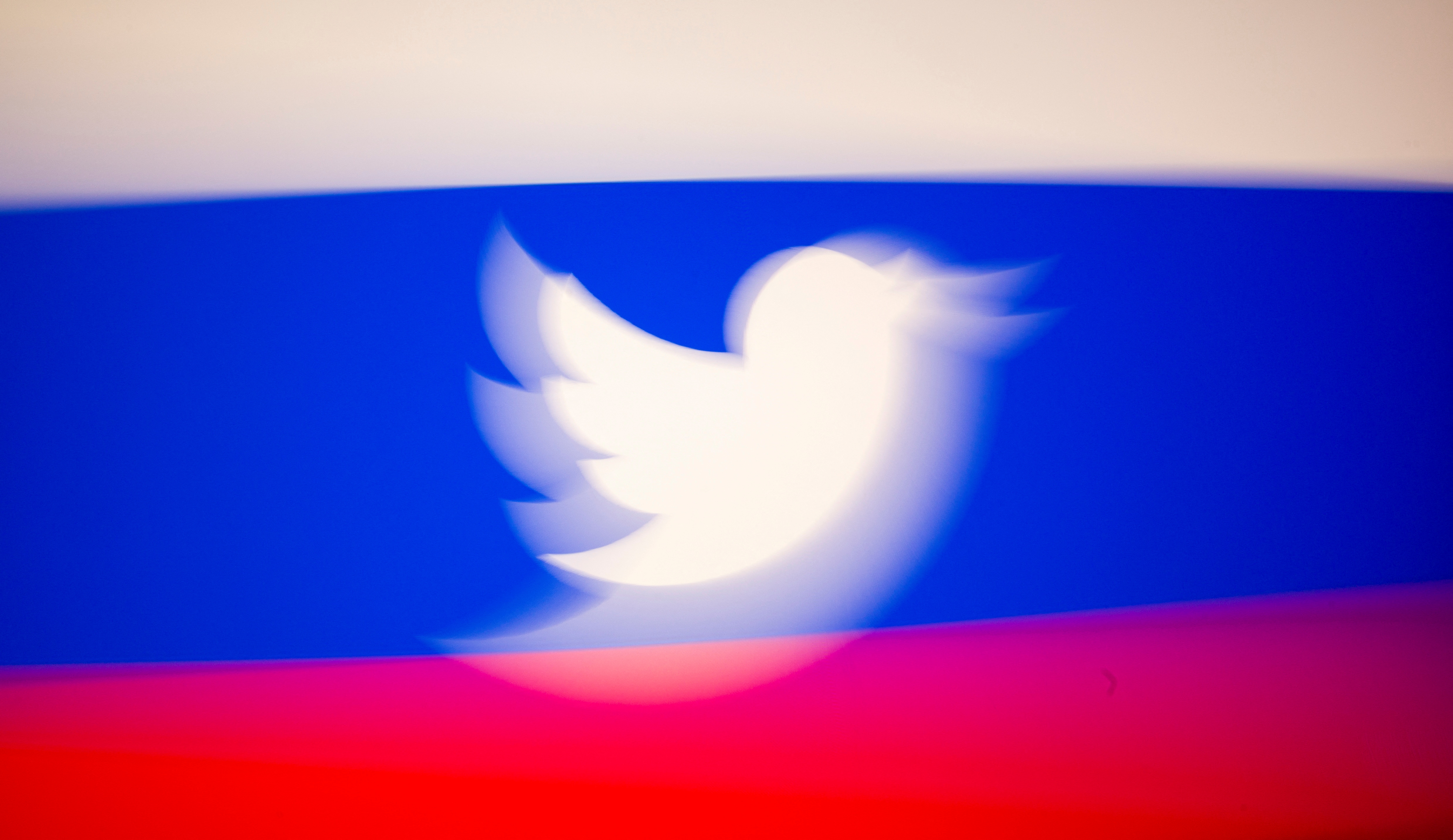 Twitter logo and a Russian flag are displayed in this illustration picture