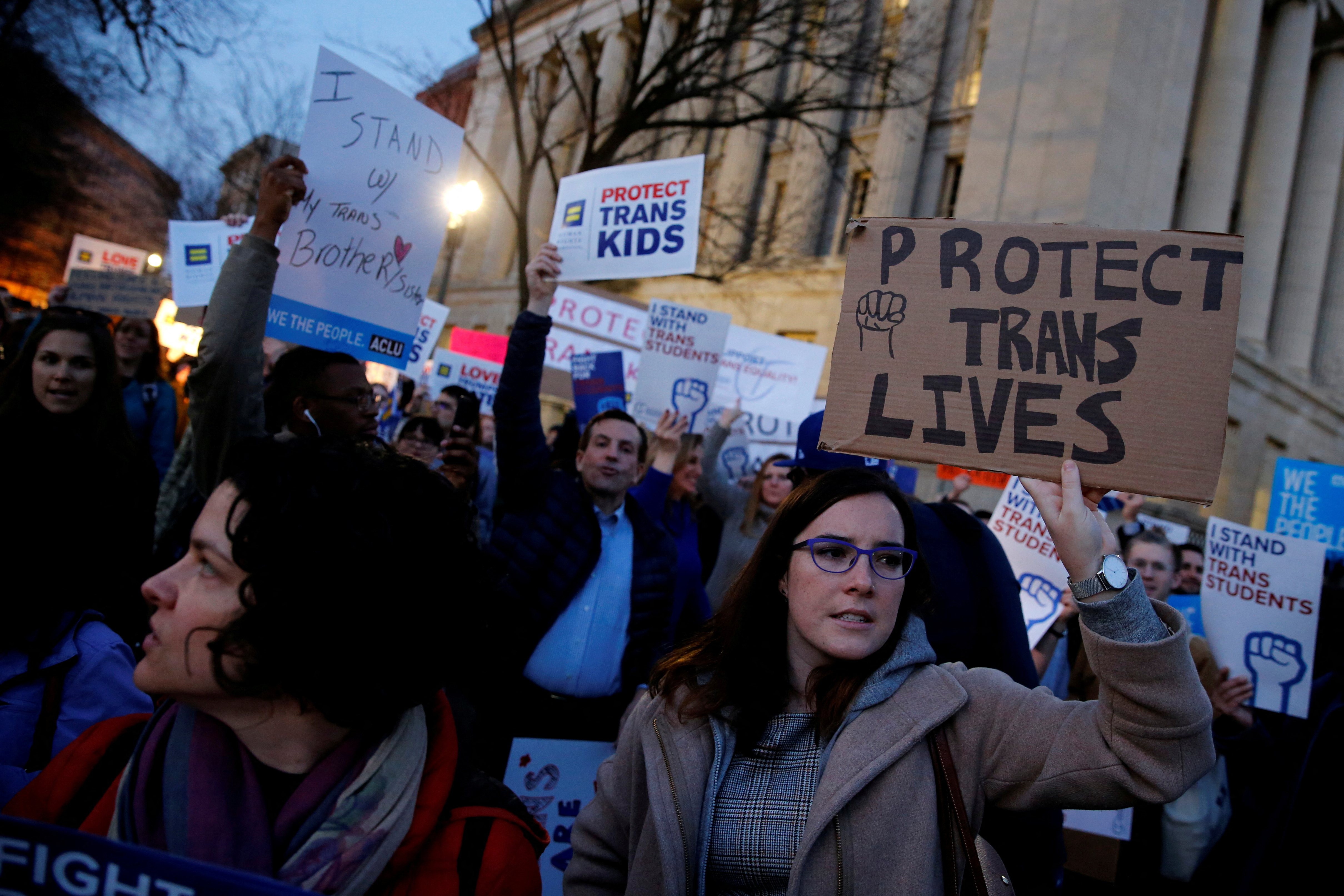Transgender activists and supporters protest near the White House in Washington