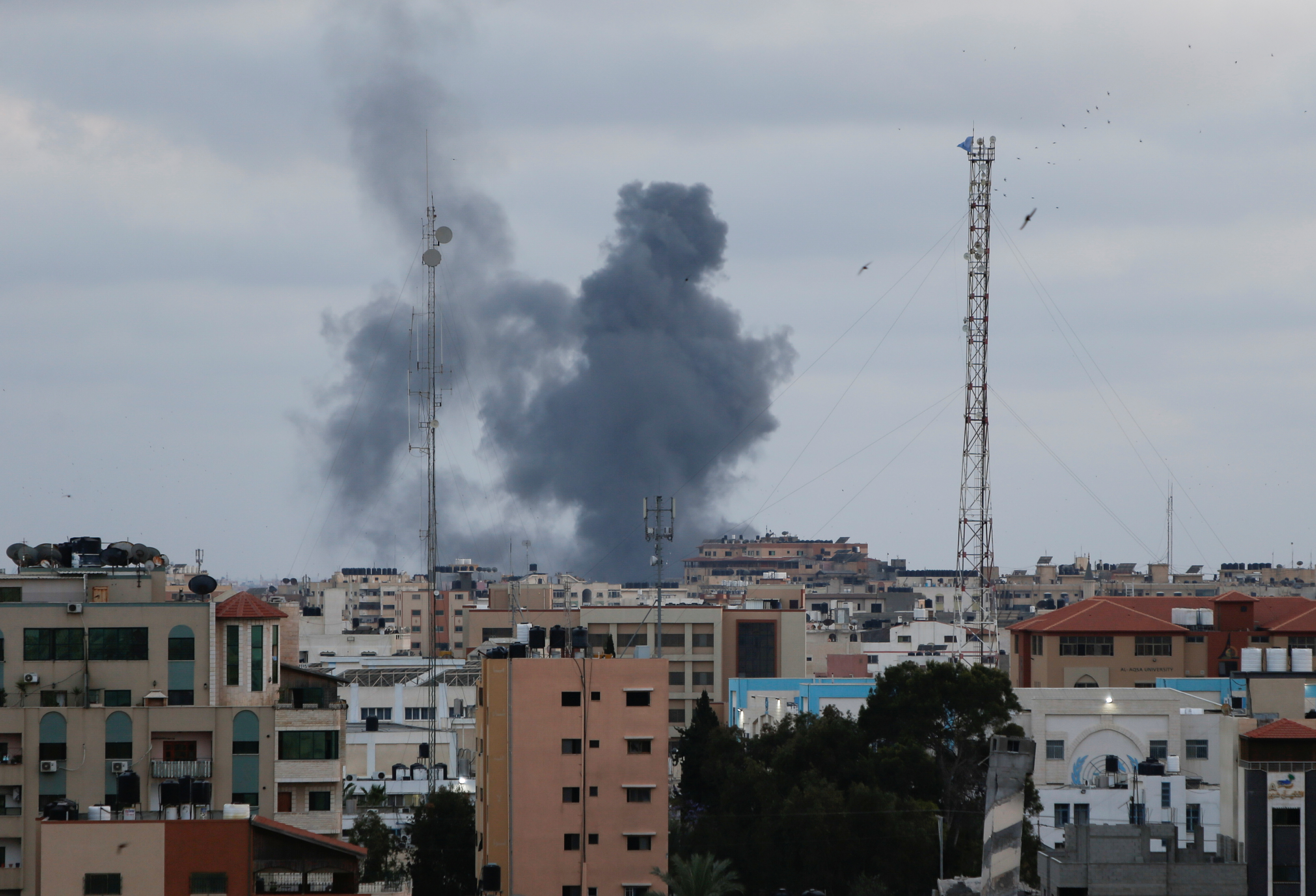 Smoke rises above buildings in Gaza