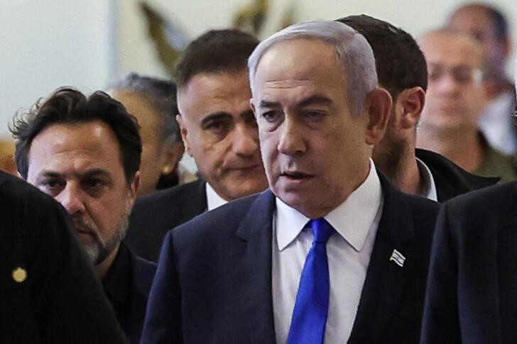 Israeli Prime Minister Netanyahu arrives to his Likud party faction meeting at the Knesset,in Jerusalem