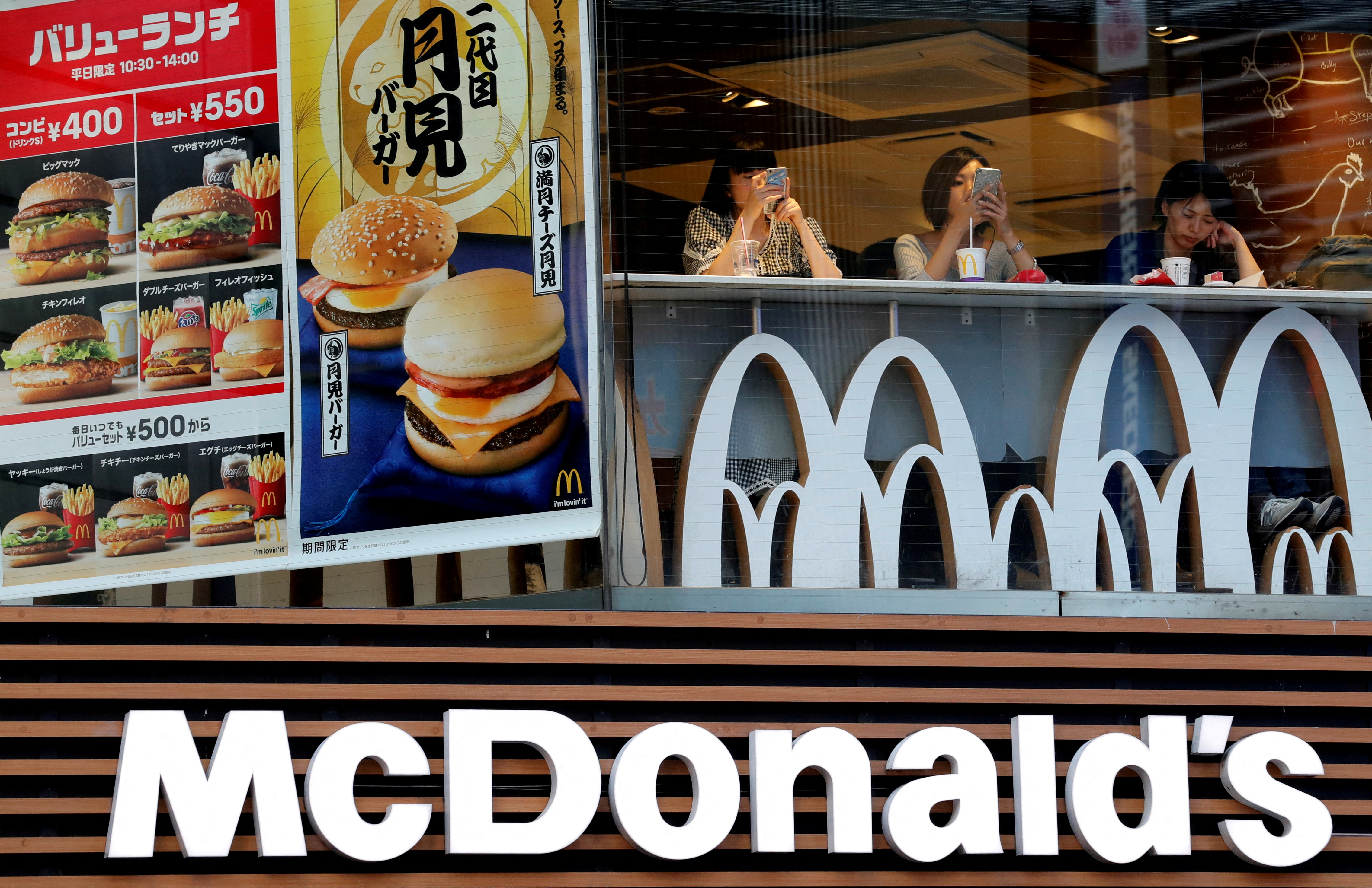 Customers are seen at a McDonald's fast food restaurant in Tokyo