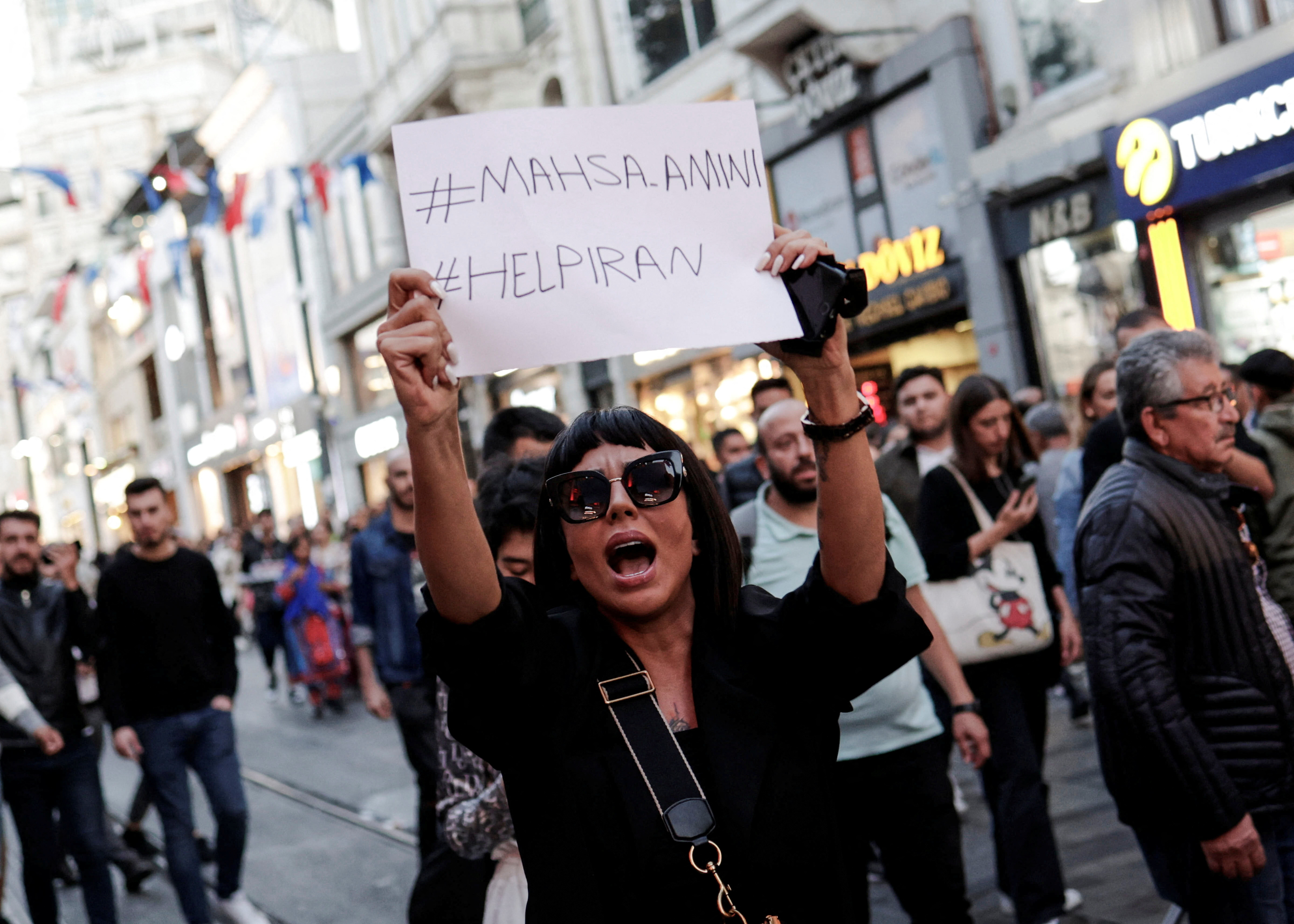 People march in solidarity with women in Iran following the death of Mahsa Amini, in Istanbul