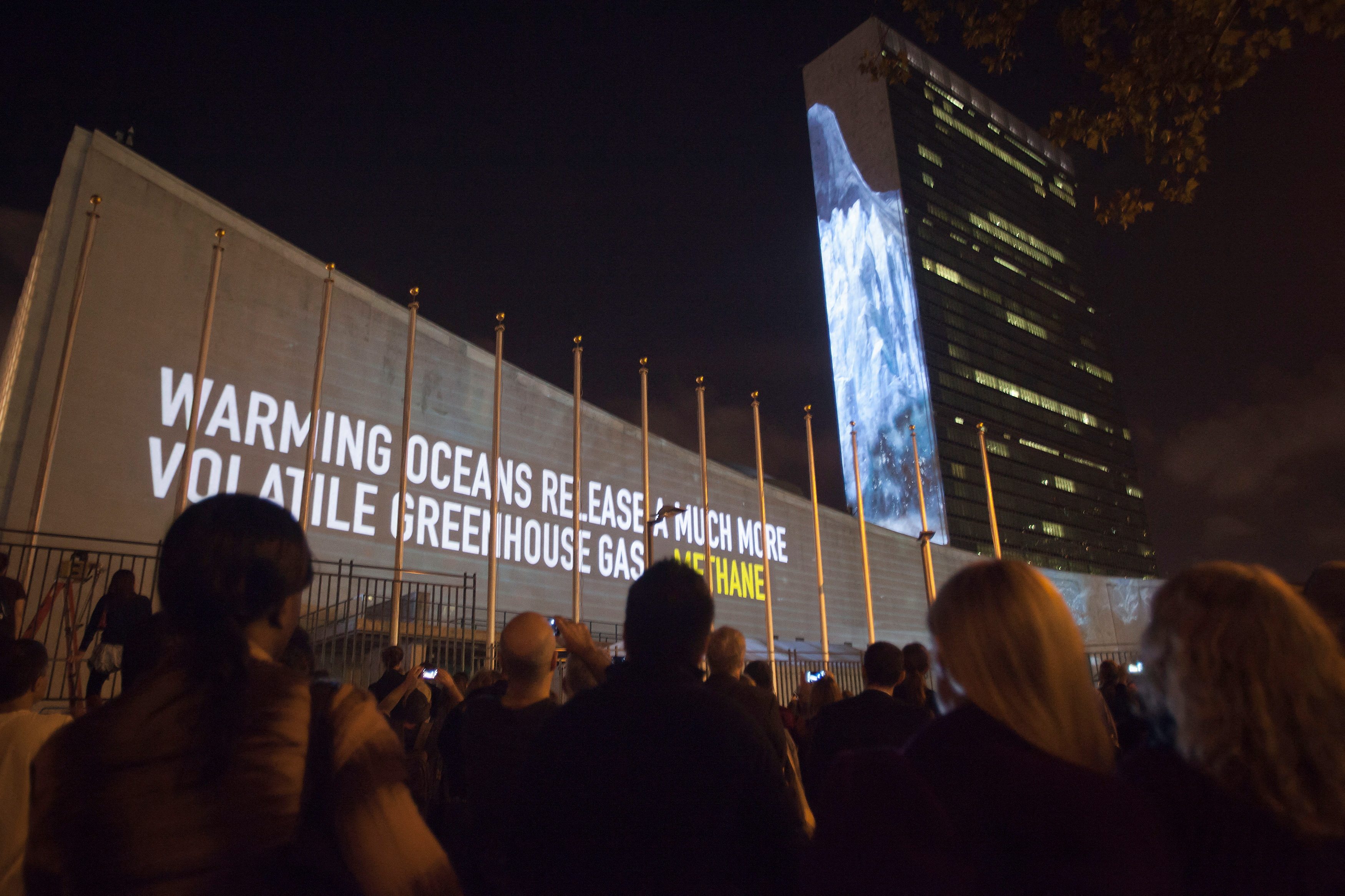 Messages on methane gas and carbon dioxide emissions are projected onto the U.N. building ahead of climate change talks in New York