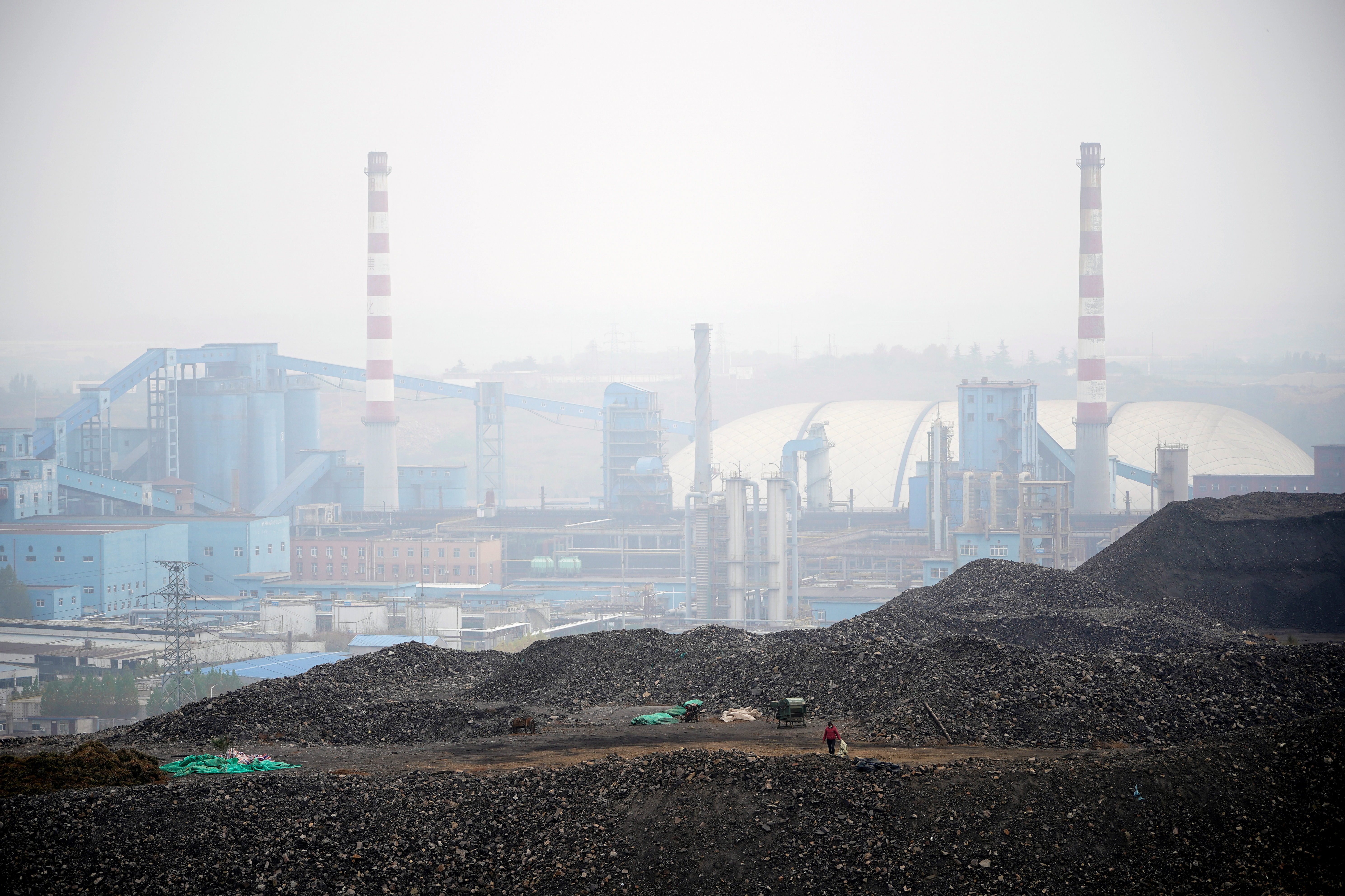 FILE PHOTO - Dunes of low-grade coal are seen near a coal mine in Ruzhou