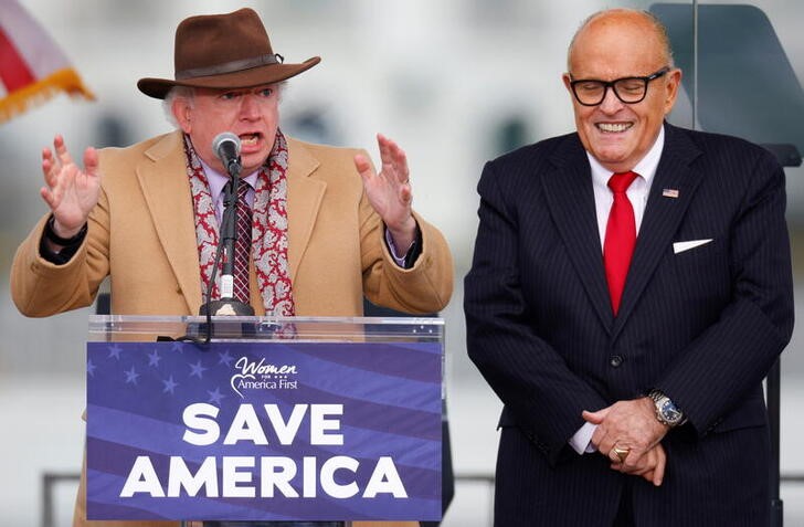 Attorney John Eastman gestures as he speaks next to U.S. President Donald Trump's personal attorney Rudy Giuliani at the January 6 Trump rally on the Ellipse in Washington