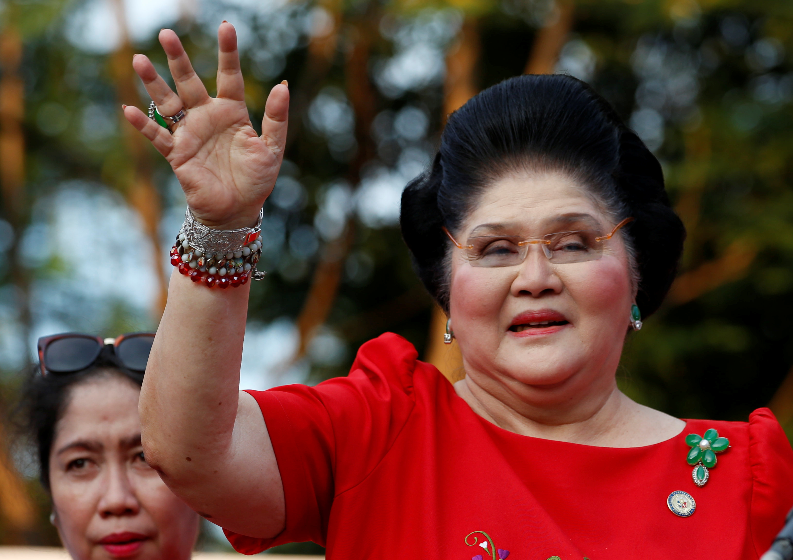 Philippines Former First Lady and Congresswoman Imelda Marcos waves to supporters as she takes part in the announcement of her son BongBong Marcos' vice-presidential candidacy, in Manila