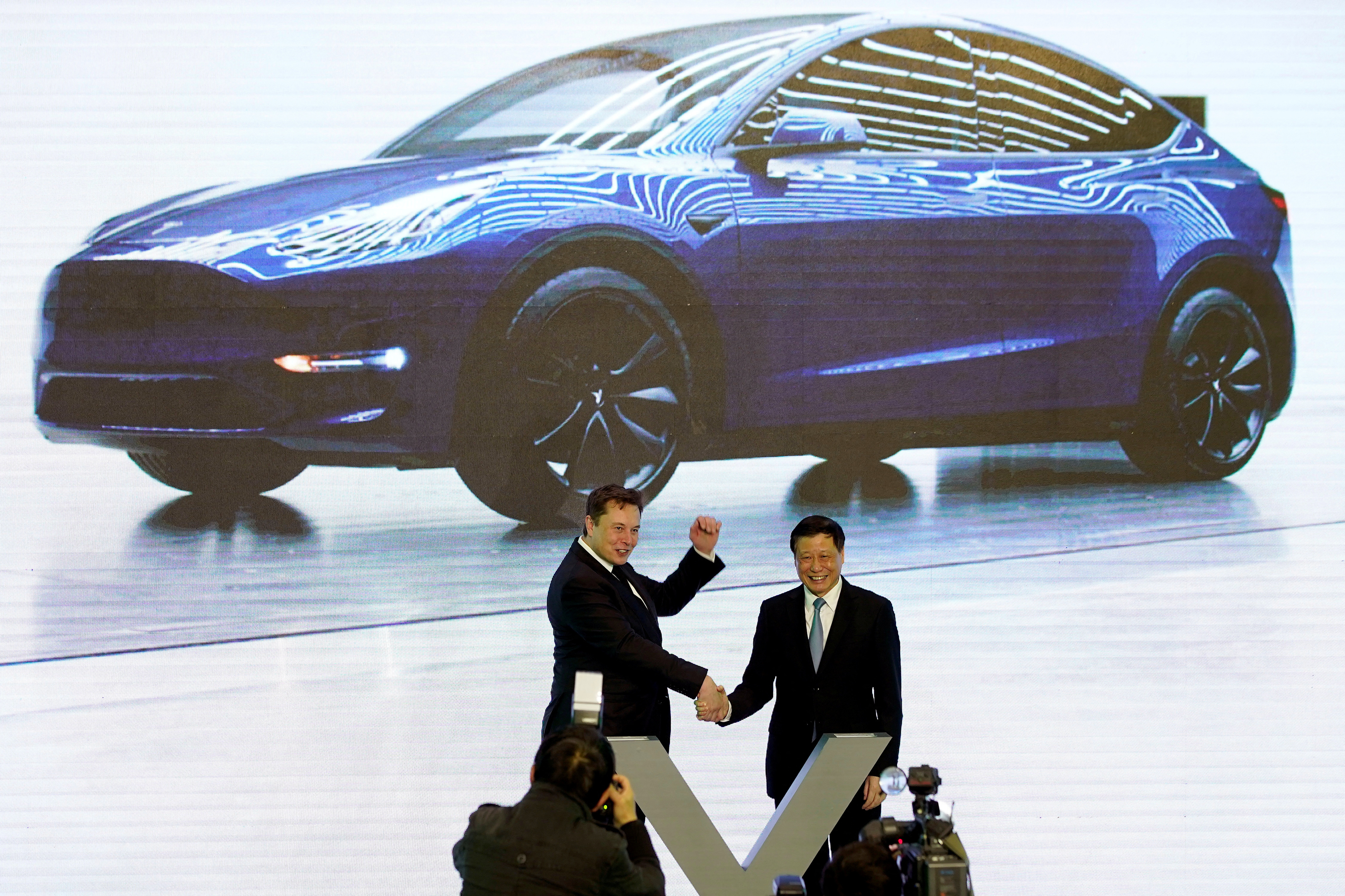 Tesla Inc CEO Elon Musk and Shanghai's Mayor Ying Yong attend an opening ceremony for Tesla China-made Model Y program in Shanghai