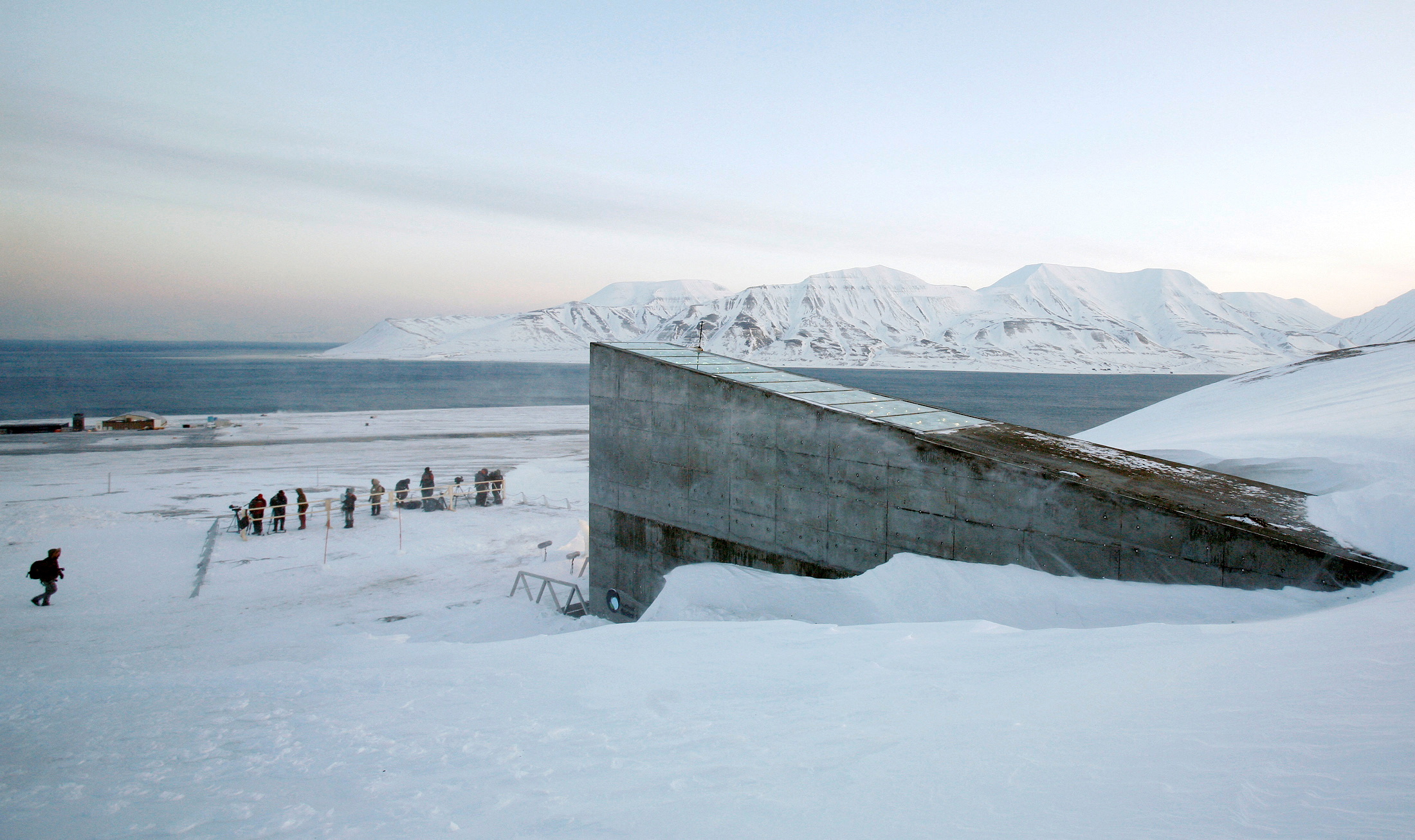 Television crews stand outside the Global Seed Vault before the opening ceremony in Longyearbyen