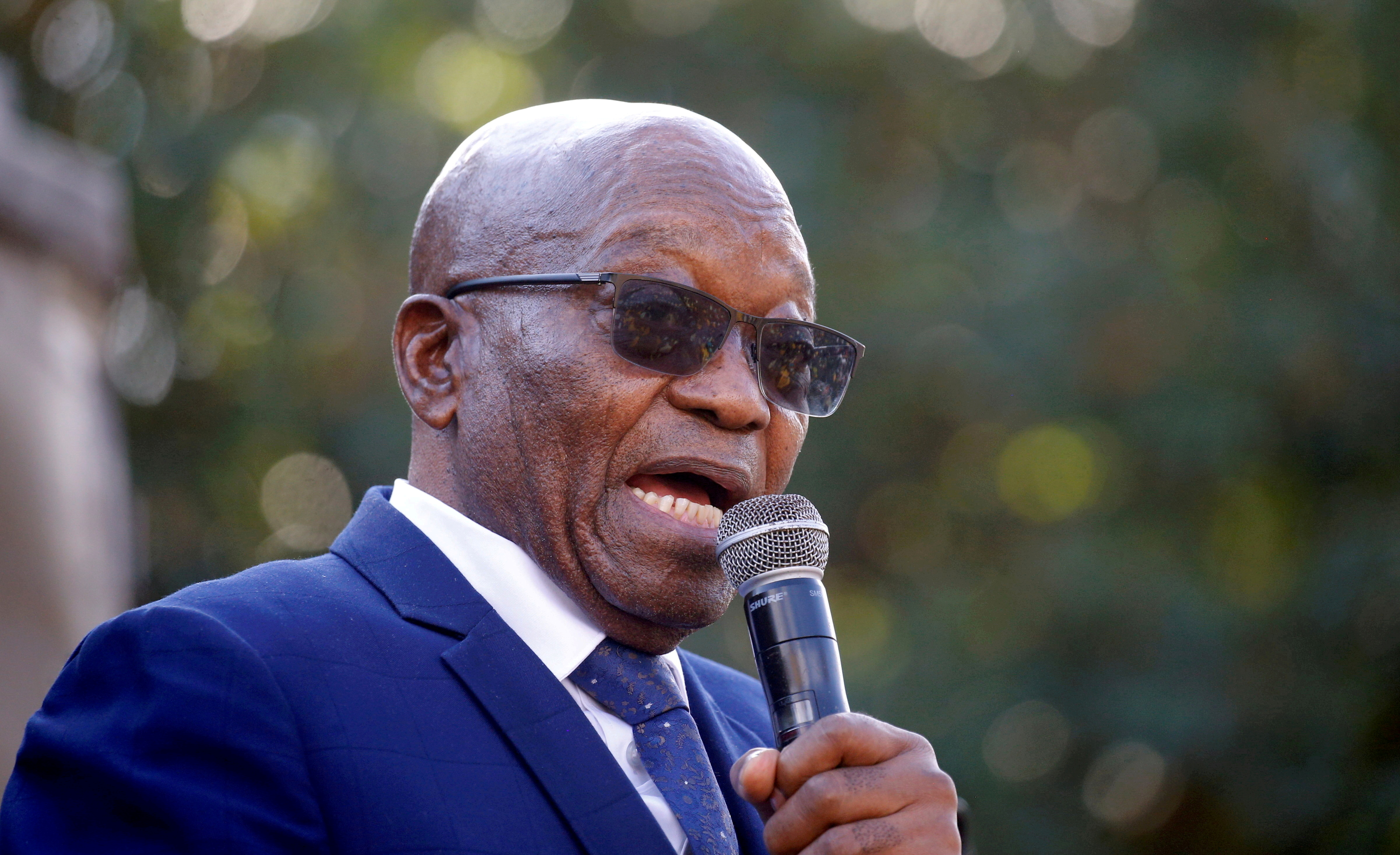 Former South African President Jacob Zuma speaks to supporters after appearing at the High Court in Pietermaritzburg
