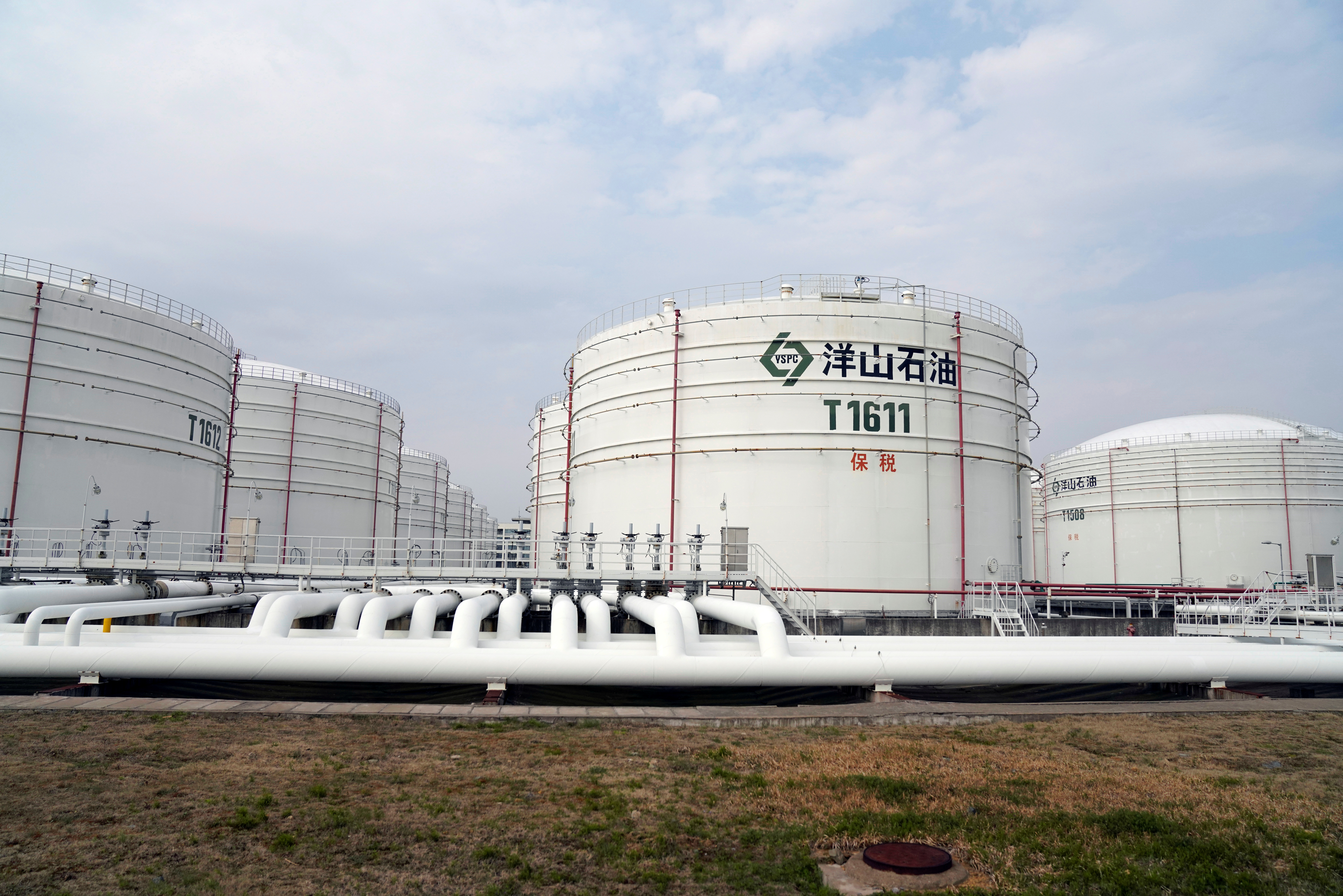 Oil tanks are seen at an oil warehouse at Yangshan port in Shanghai