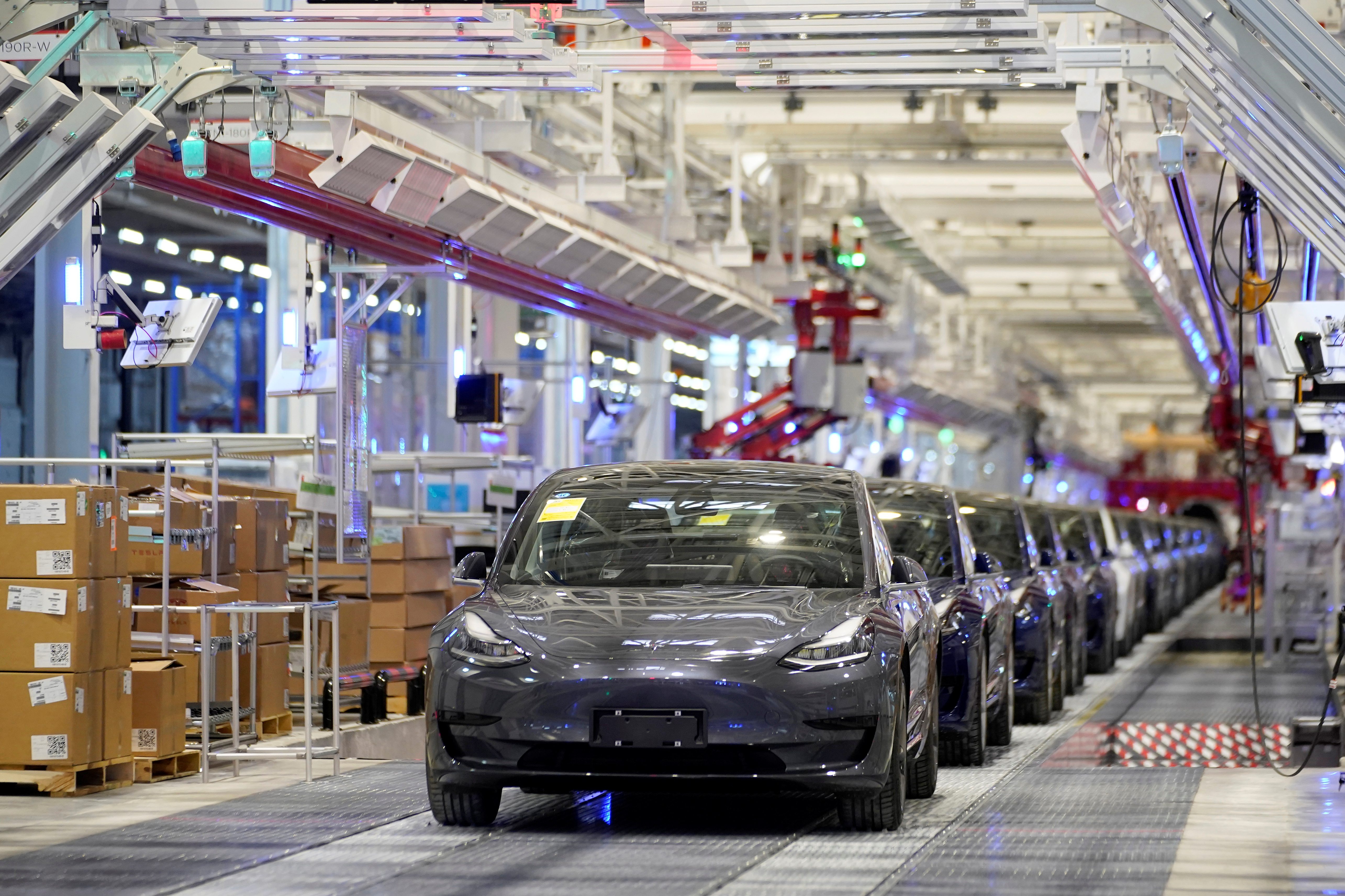 Tesla China-made Model 3 vehicles are seen during a delivery event at its factory in Shanghai