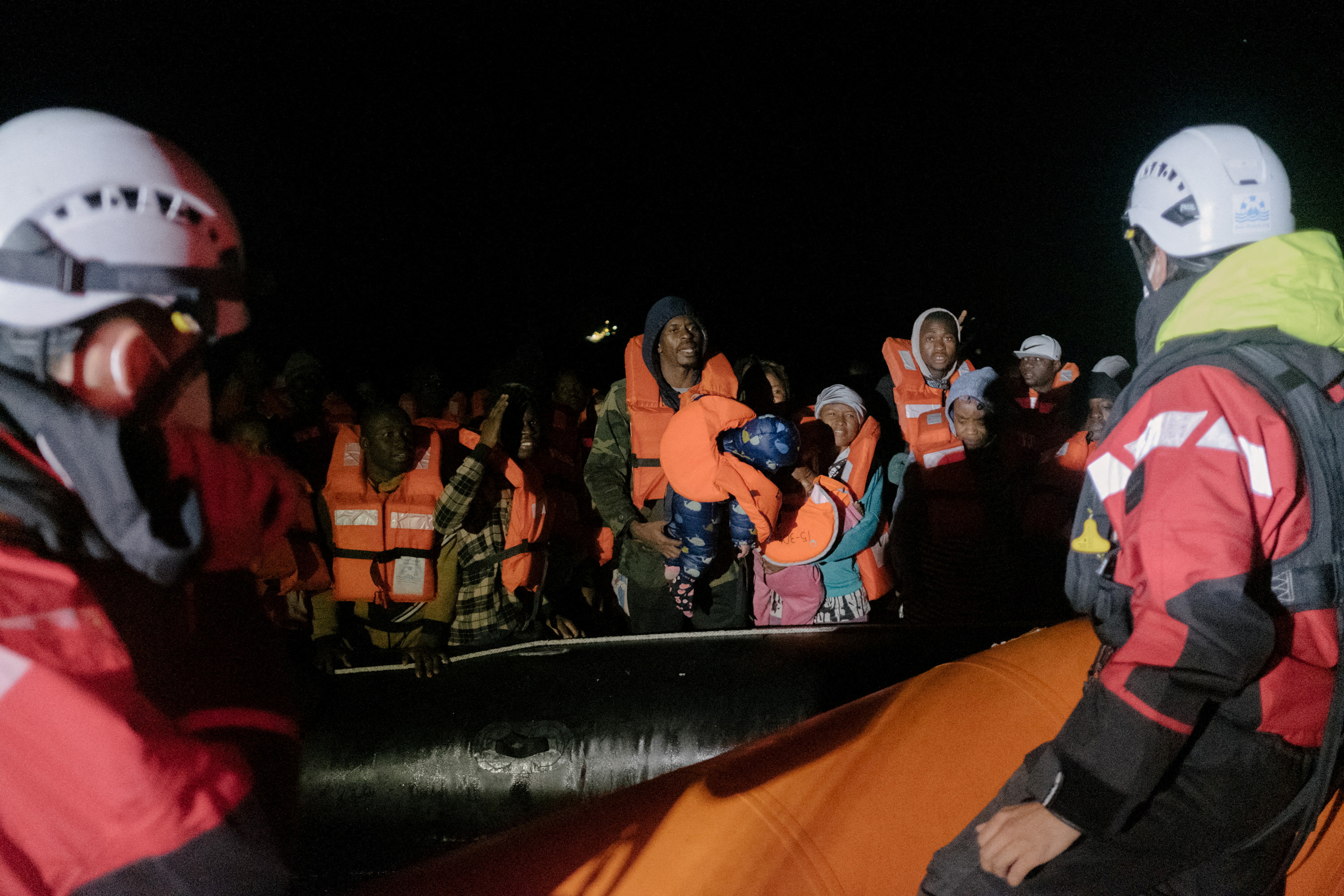Migrants are rescued by members of the German NGO Sea-Watch during a search and rescue (SAR) operation in the Mediterranean Sea on Christmas day, December 25, 2021.  Max Brugger/Sea Watch/Handout via REUTERS 