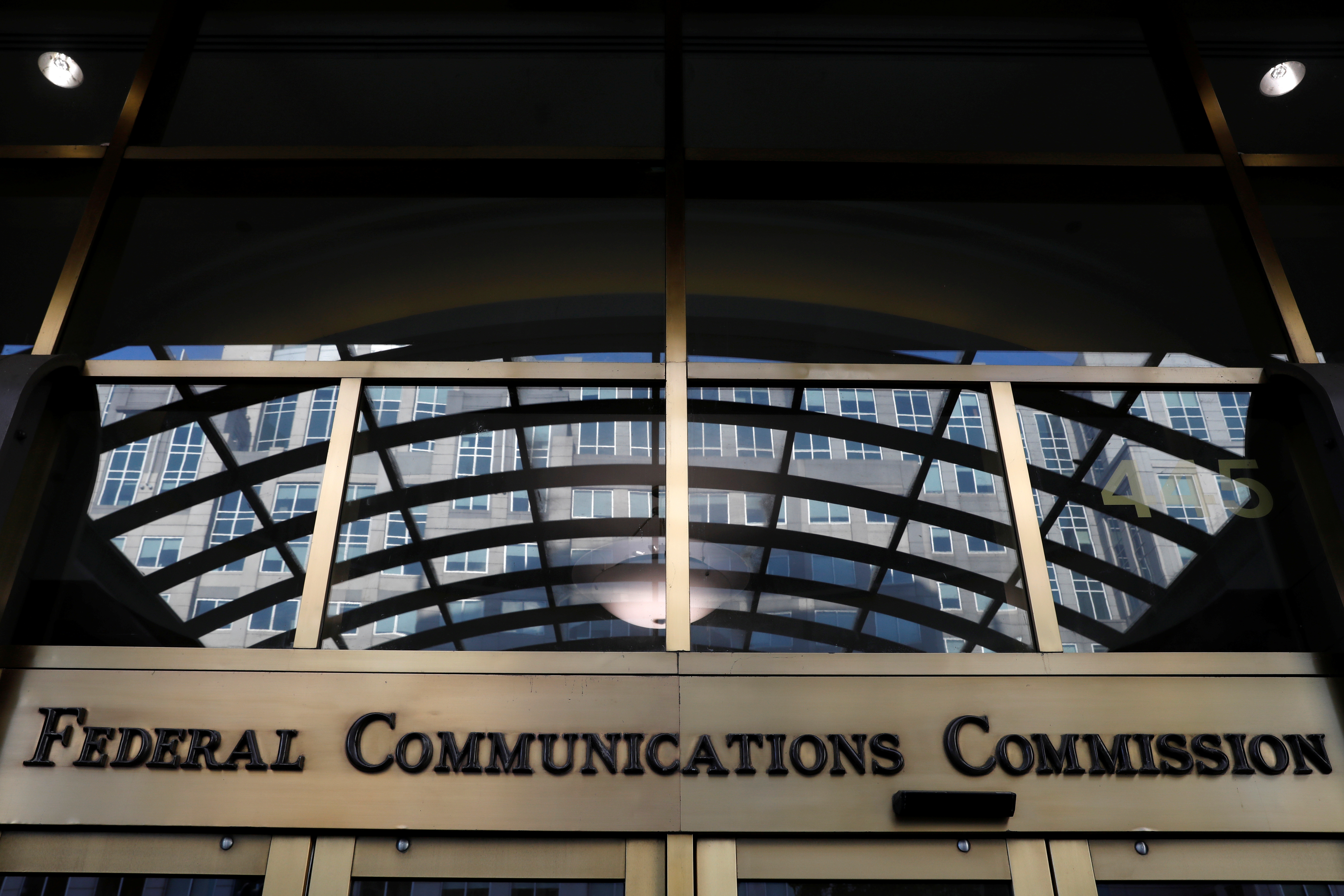 Signage is seen at the headquarters of the Federal Communications Commission in Washington, D.C., U.S., August 29, 2020. REUTERS/Andrew Kelly