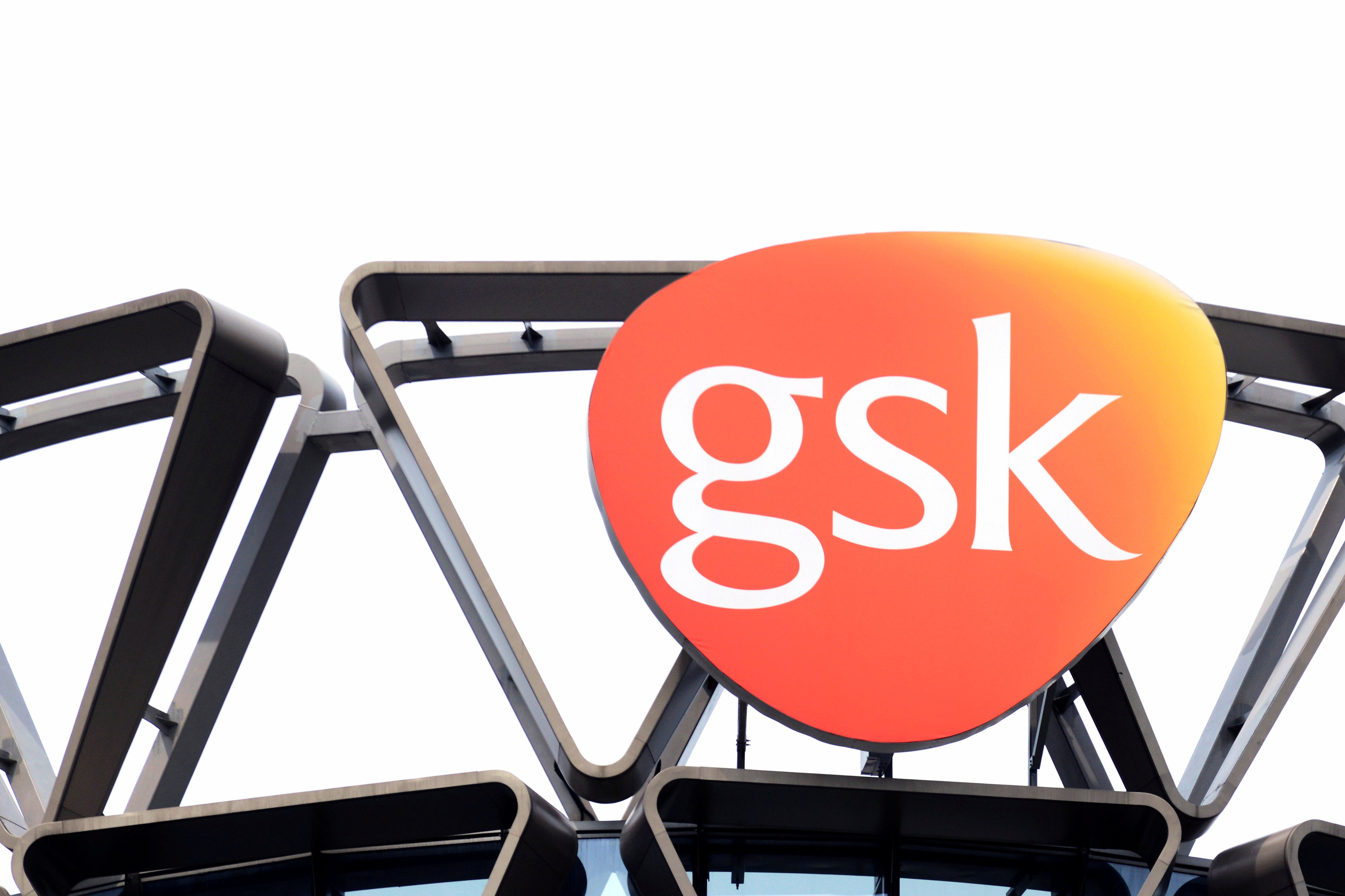 The GlaxoSmithKline (GSK) logo is seen on top of GSK Asia House in Singapore, March 21, 2018. Picture taken March 21, 2018. REUTERS/Loriene Perera/File Photo