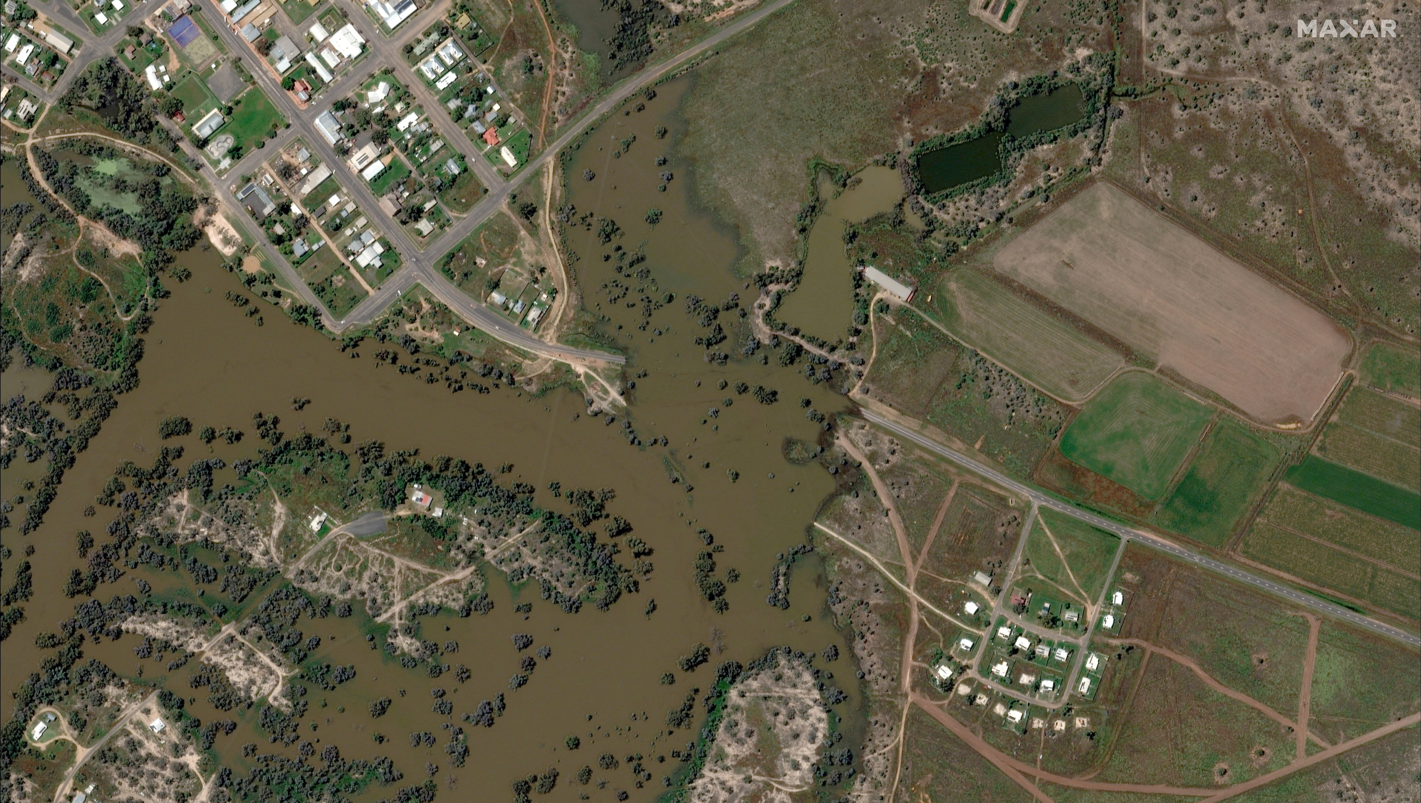 A satellite image shows a flooded road in Brewarrina, Australia