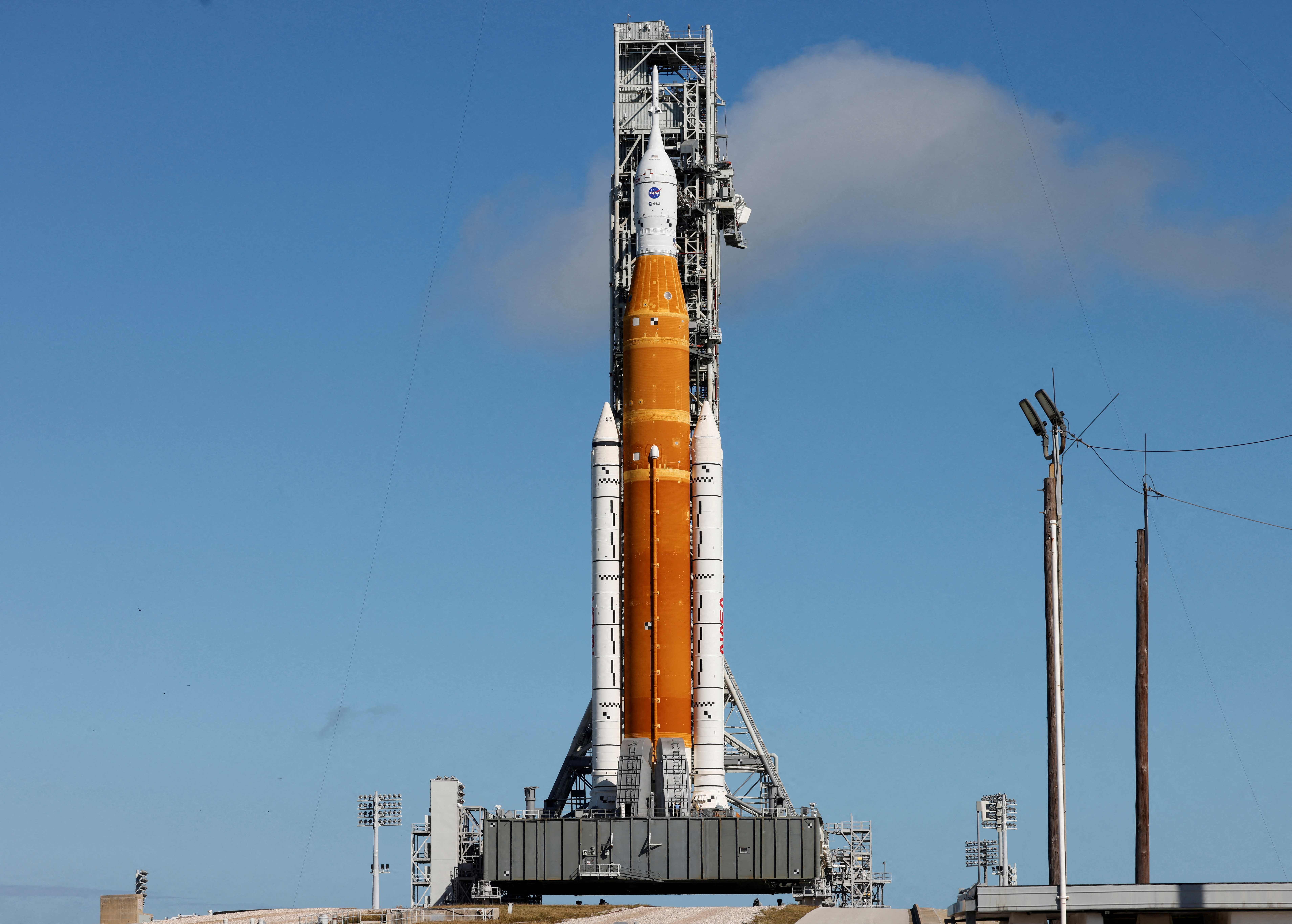 NASA's next-generation moon rocket, the Space Launch System (SLS) rocket with its Orion crew capsule perched on top, is shown on its launch pad as it is prepared for launch in Cape Canaveral