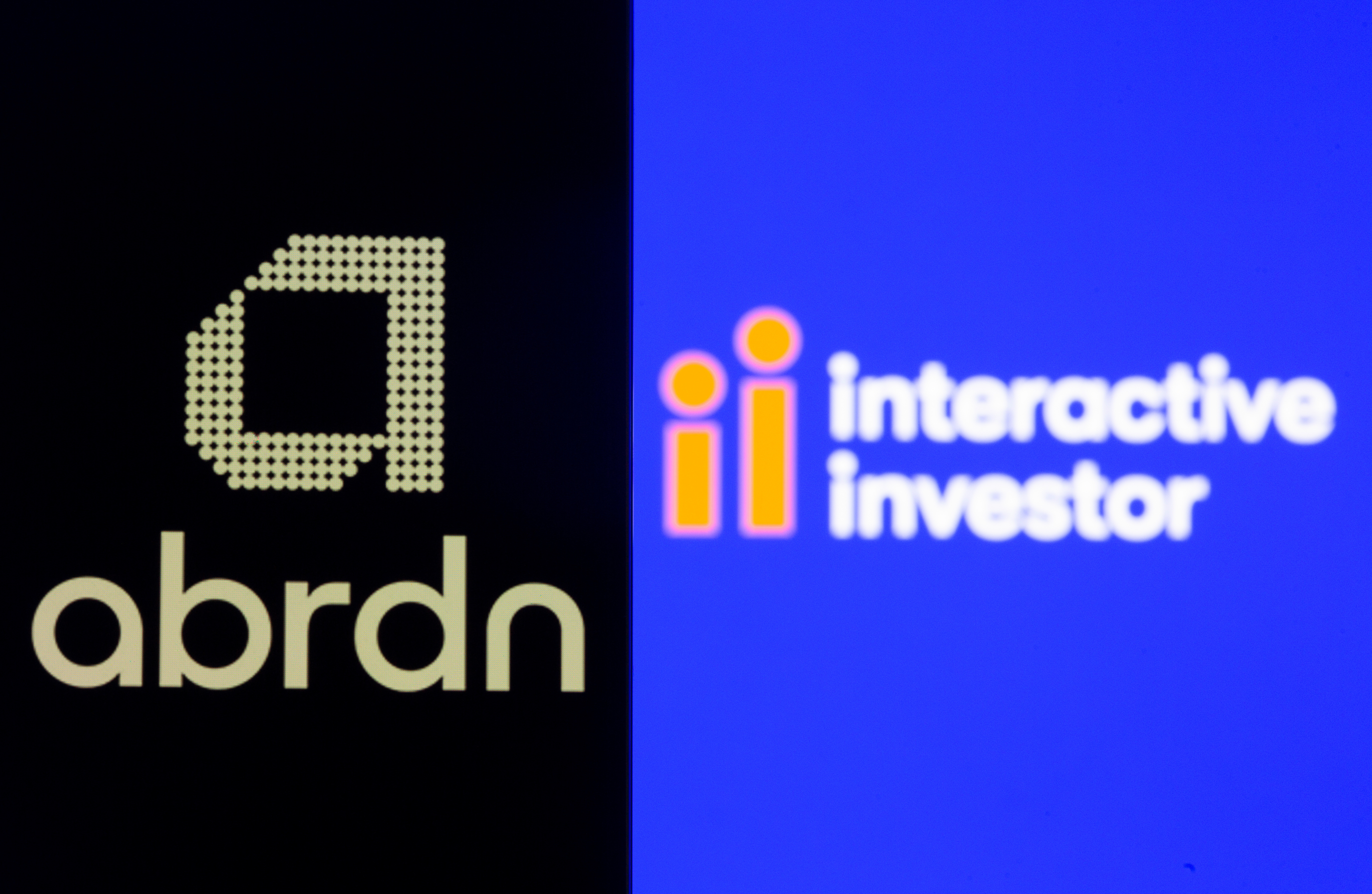 Smartphone with Abrdn logo is seen in front of displayed Interactive Investor logo in this illustration taken