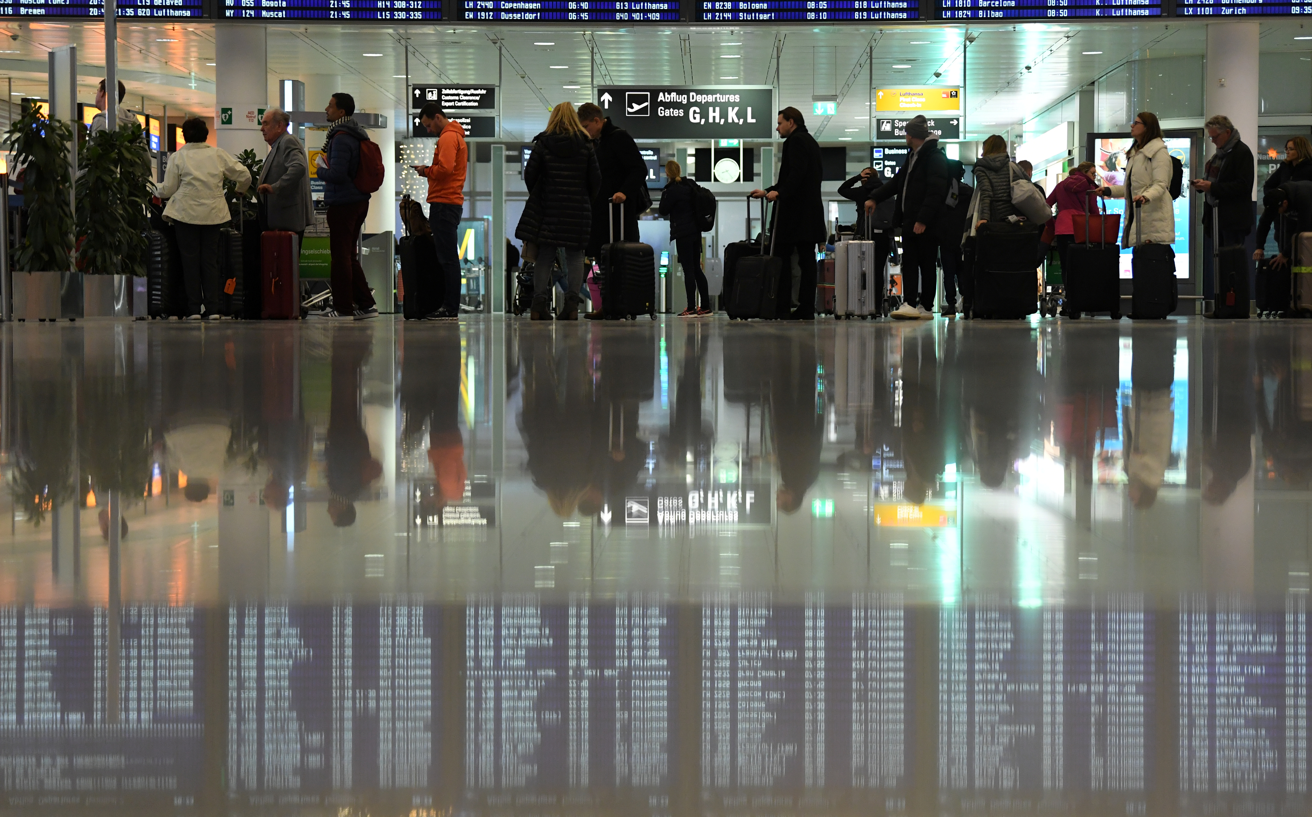 Passengers queue at Munich Airport