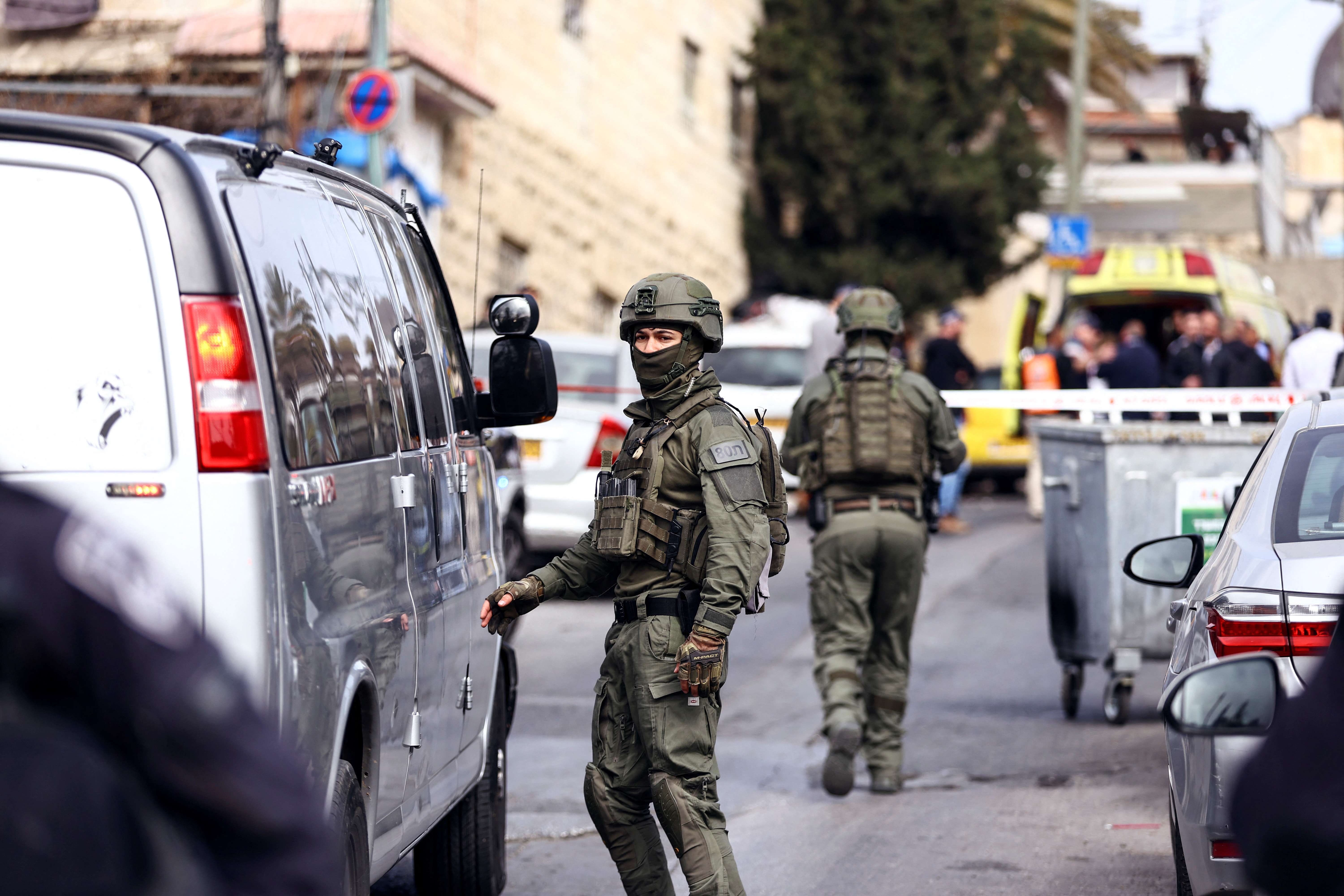 Israeli security personnel work near a scene where a suspected incident of shooting attack took place, police spokesman said, just outside Jerusalem's Old City