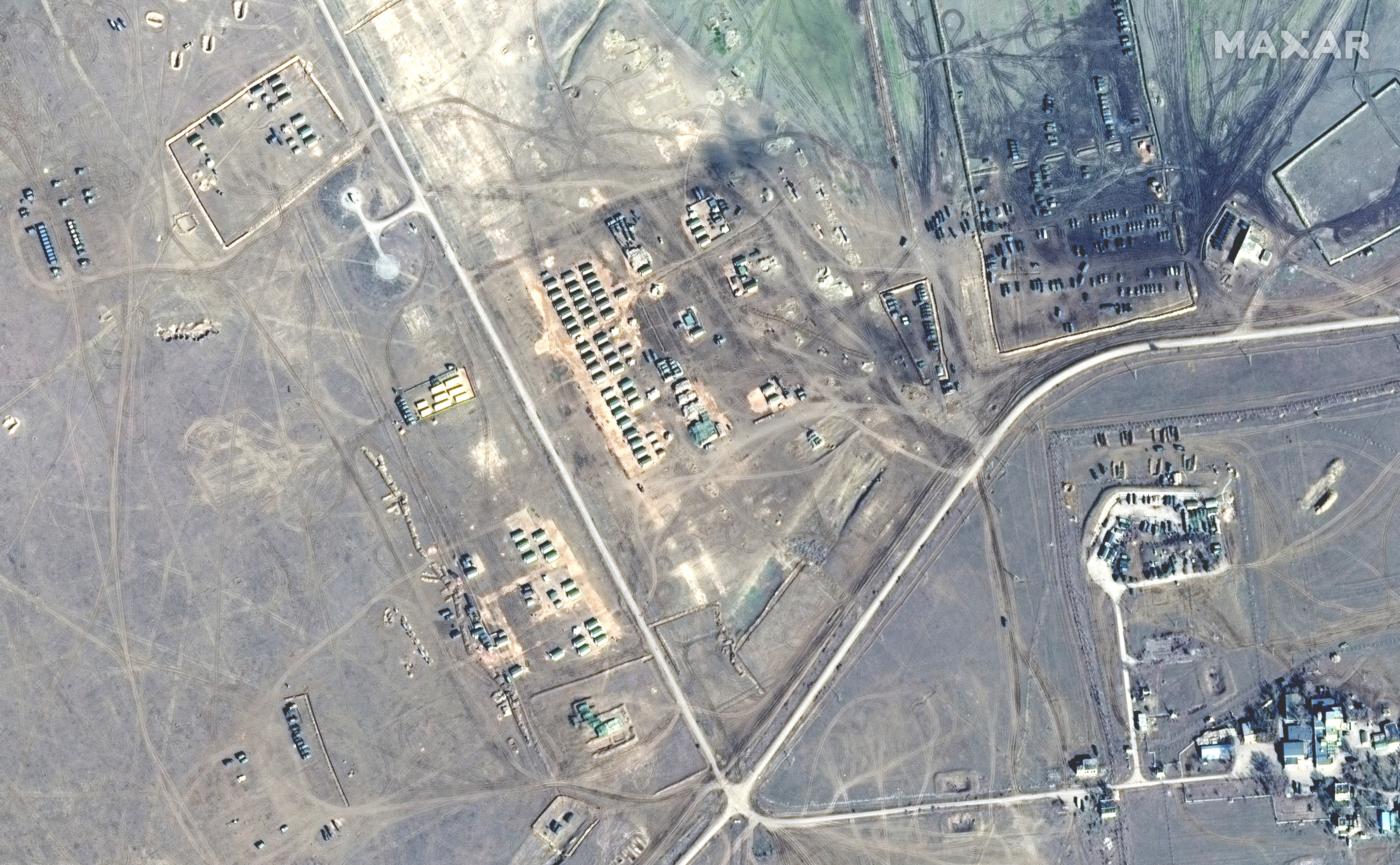 A satellite image shows tents and artillery at Opuk training area, in Crimea