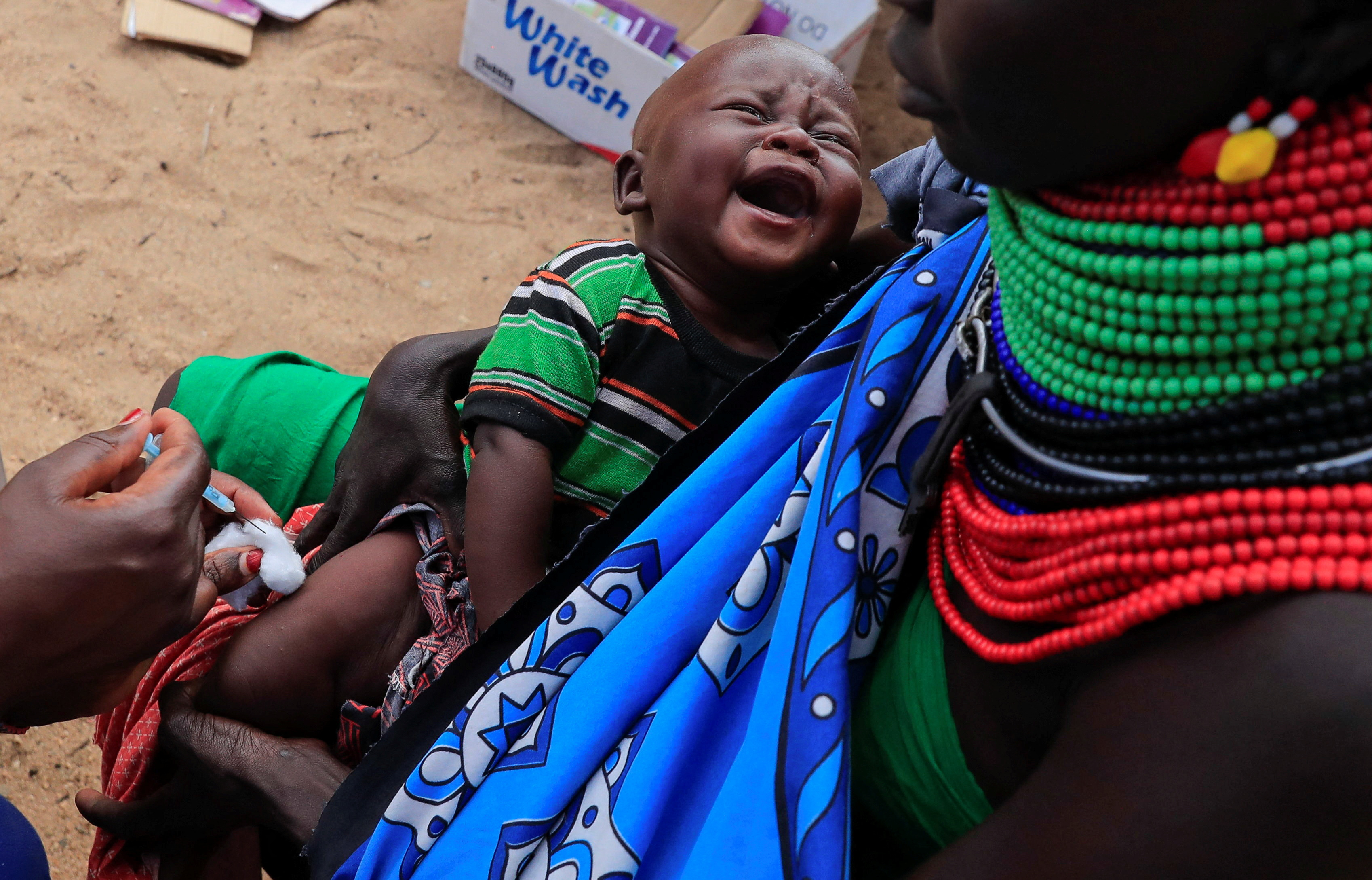A child from the Turkana pastoralist community affected by the worsening drought due to failed rain seasons, gets a vaccine at an integrated outreach medical clinic in Kakimat village in Turkana