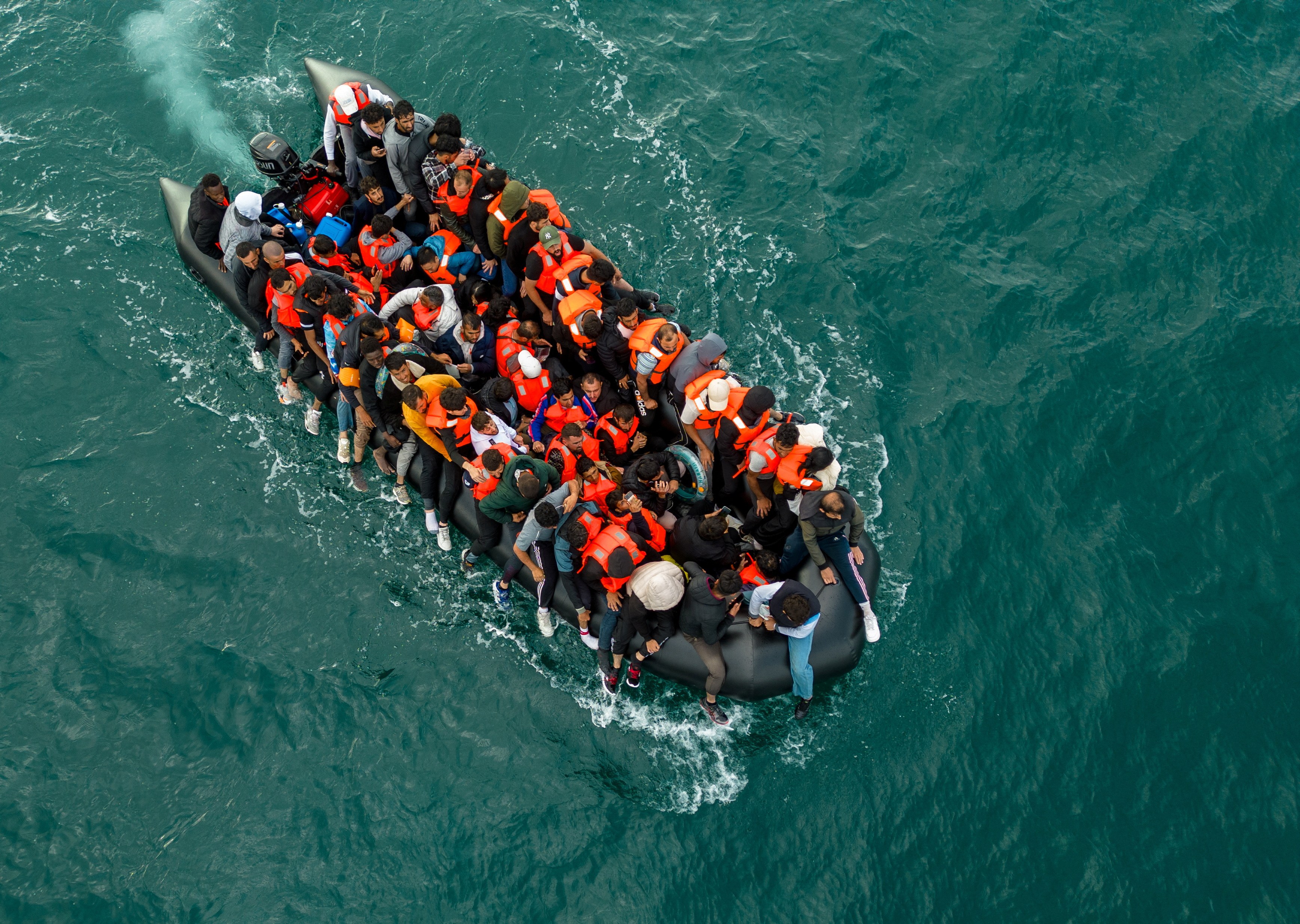 Migrants cross the English Channel in small boats