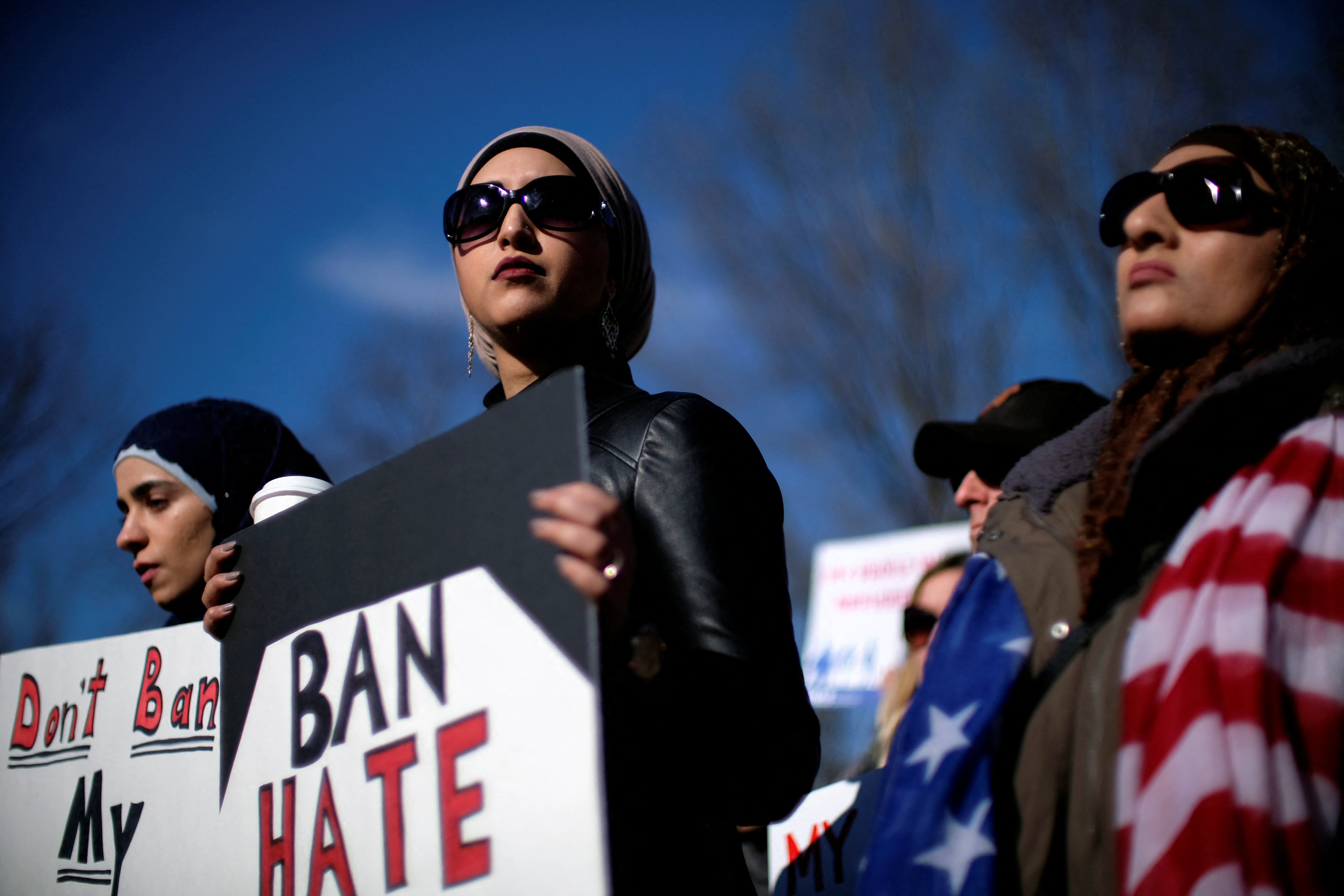 Activist groups including the Council on American-Islamic Relations, MoveOn.org, Oxfam, and the ACLU hold a rally in front of the White House to mark the anniversary of the first Trump administration travel and refugee ban in Washington