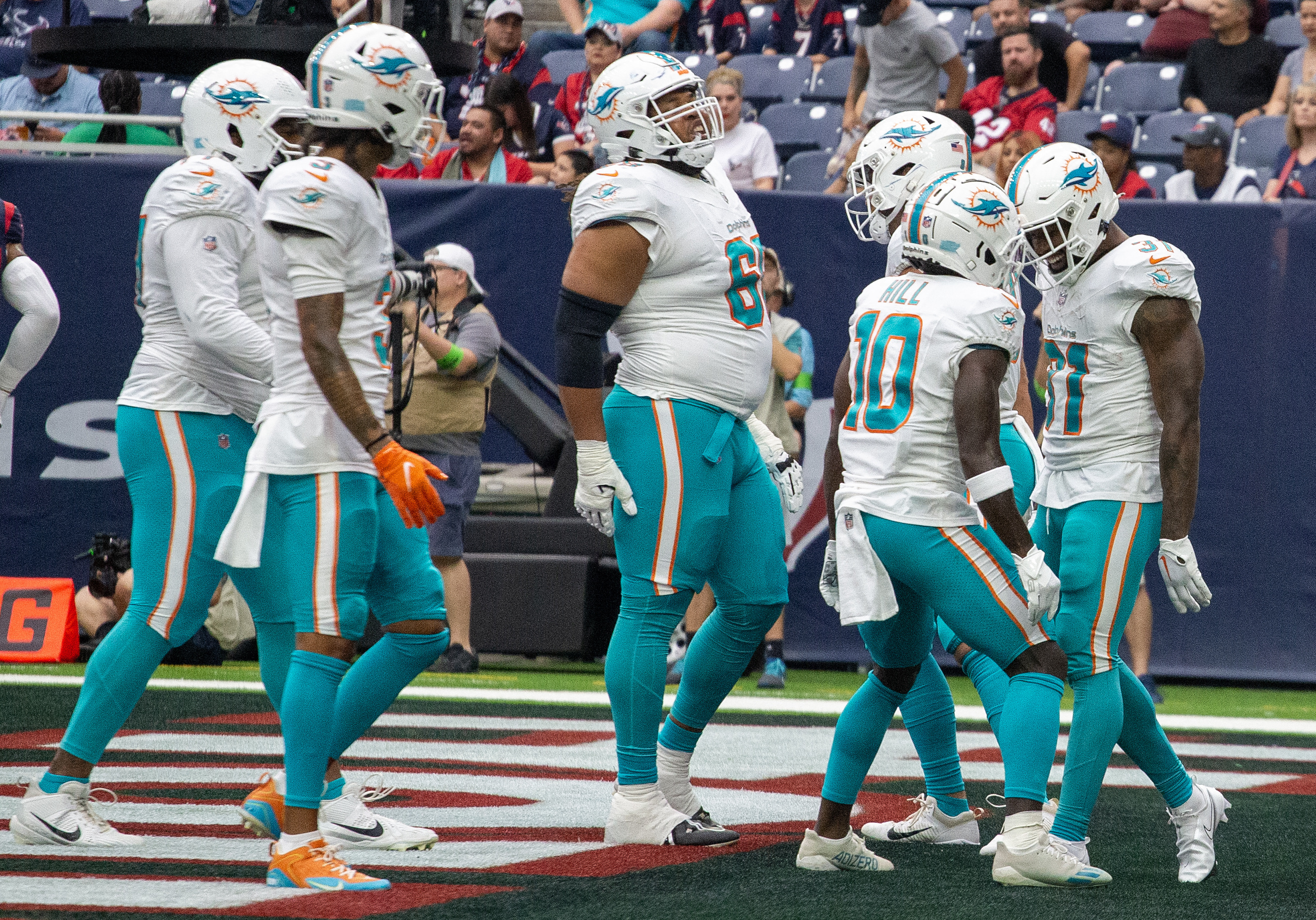 Miami. FL USA; Miami Dolphins quarterback Skylar Thompson (19) rolls out of  the pocket during an NFL game against the Houston Texans at the Hard Rock  Stadium, Sunday, November 27. The Dolphins