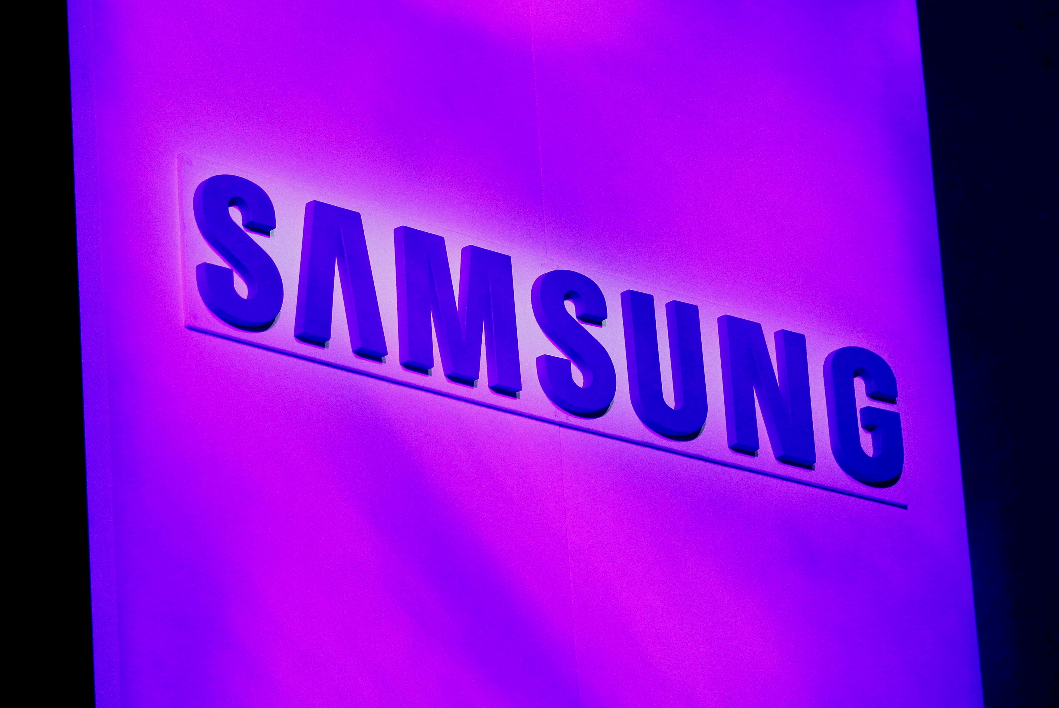 The company logo is displayed at the Samsung news conference at the Consumer Electronics Show (CES) in Las Vegas January 7, 2013. REUTERS/Rick Wilking/File Photo