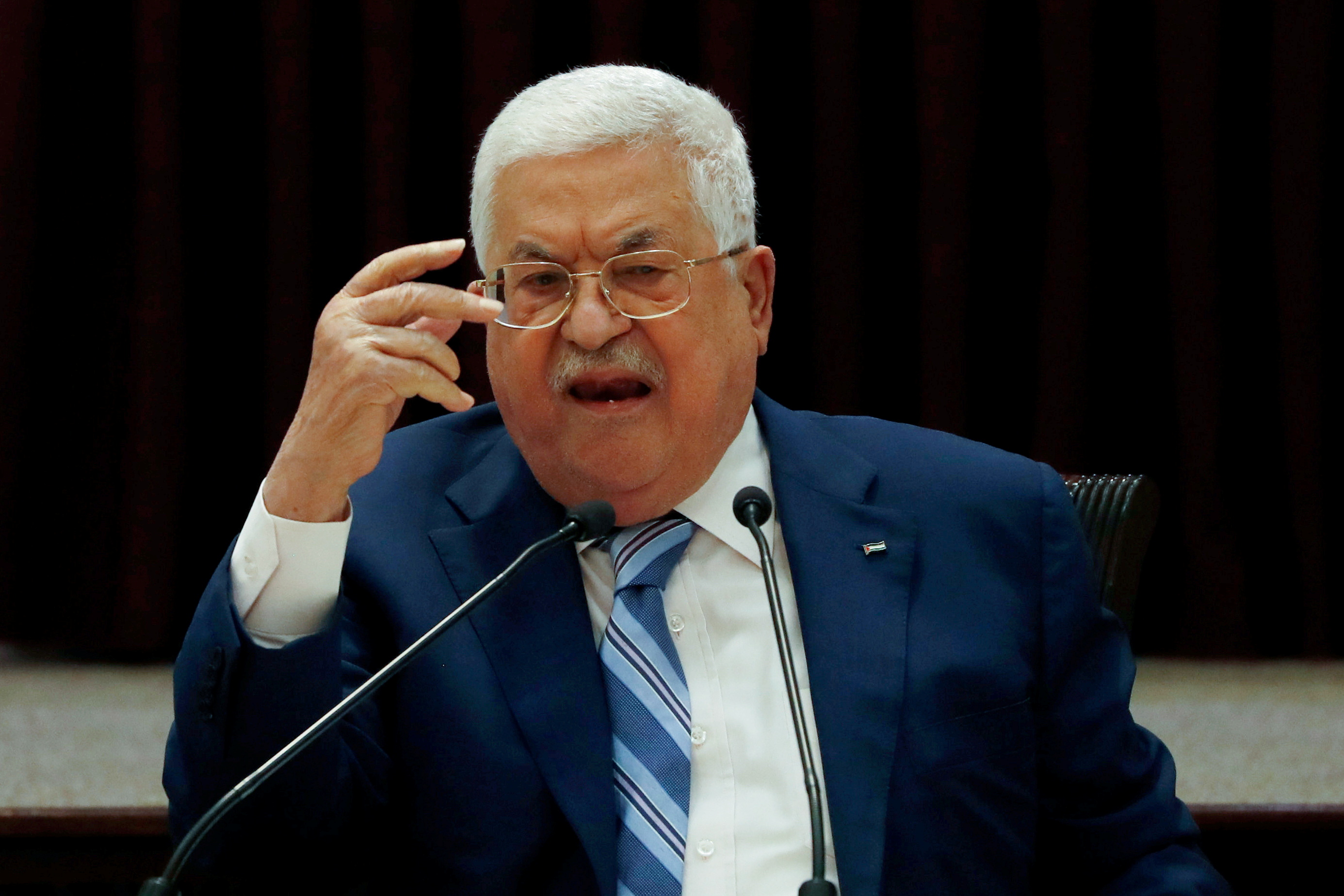 President Mahmoud Abbas gestures during a meeting in Ramallah