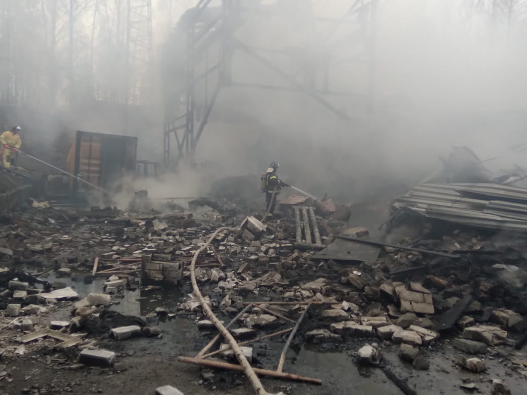 Firefighters work to put out a fire at a gunpowder and chemicals plant in Ryazan Region