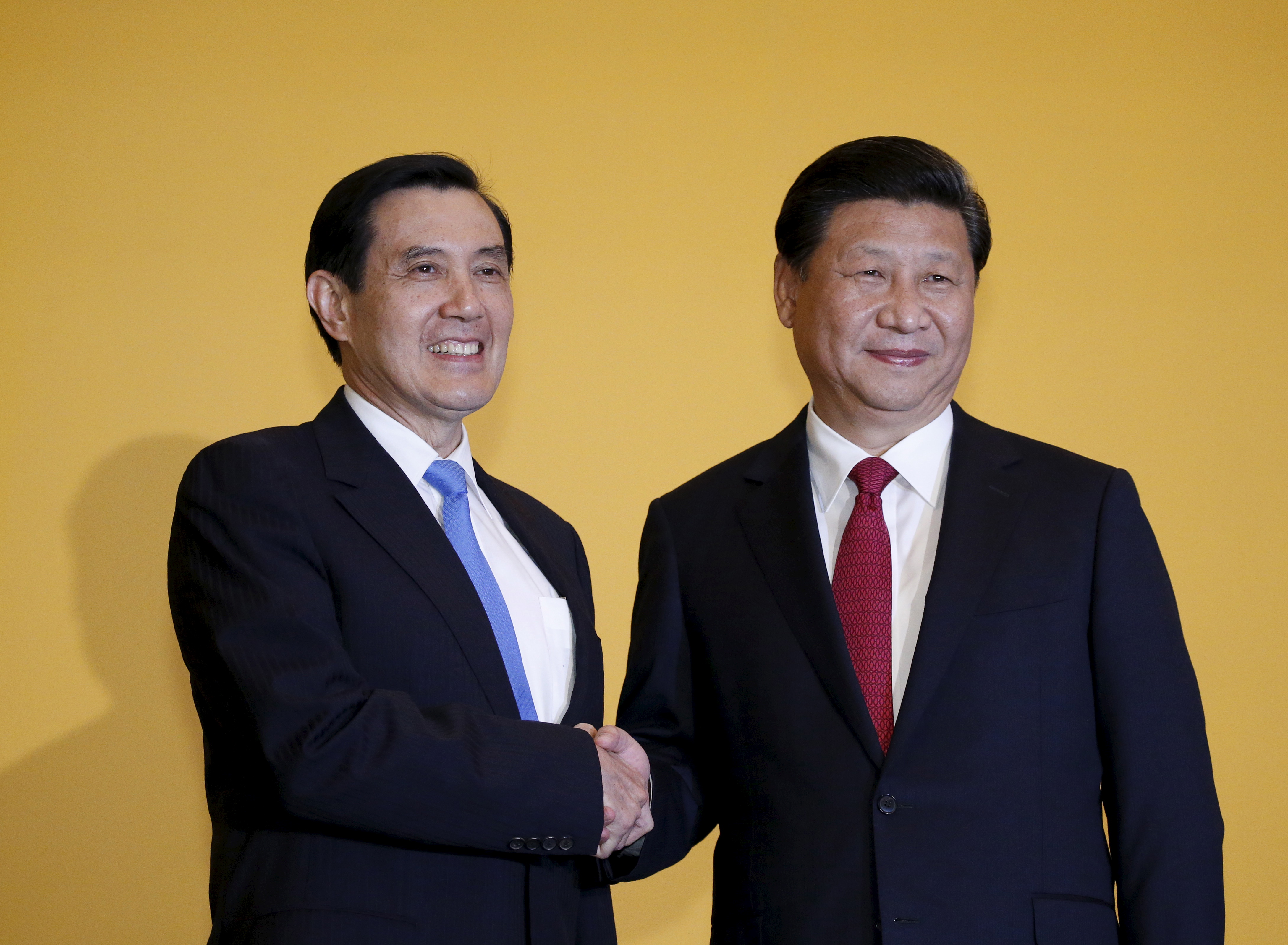 Chinese President Xi Jinping shakes hands with Taiwan's President Ma Ying-jeou during a summit in Singapore 