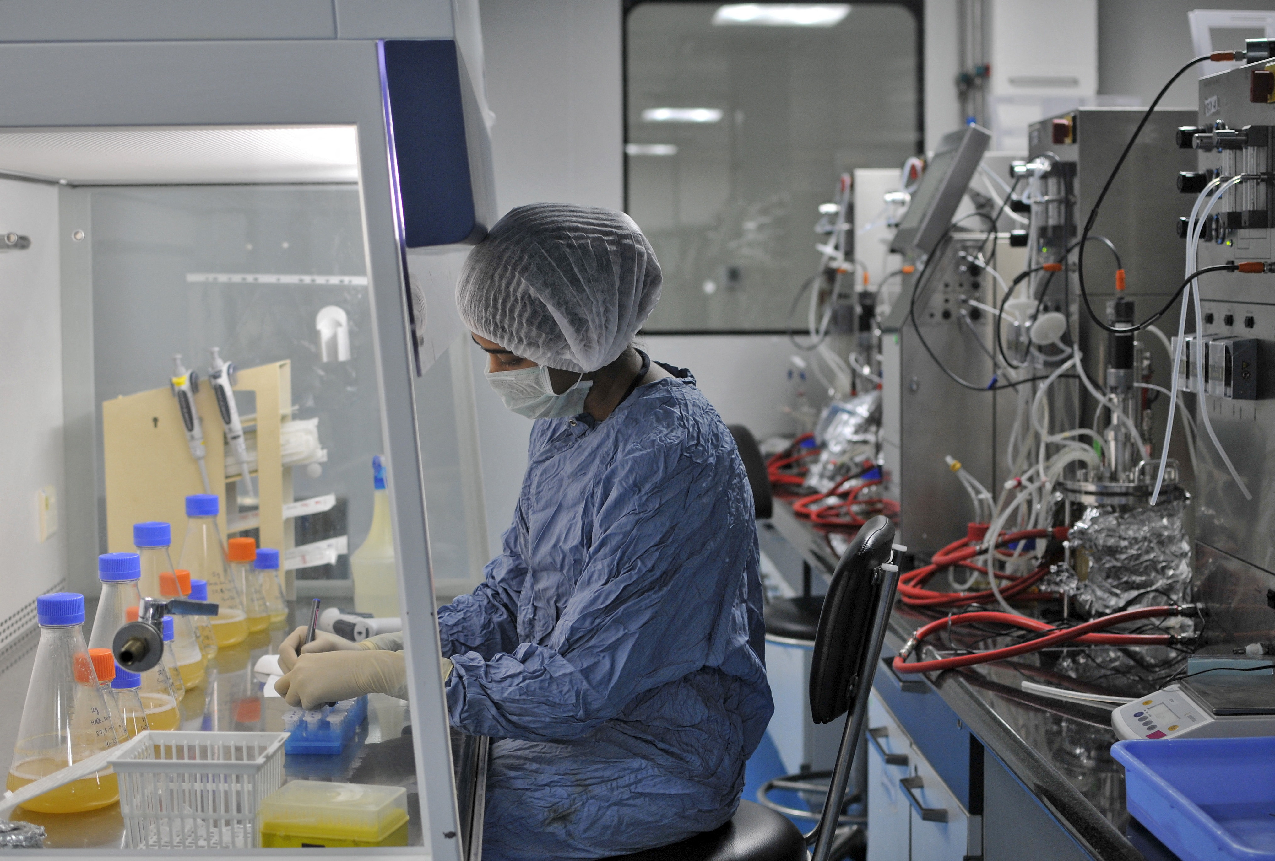 An employee of Biocon Ltd works inside the company's research and development centre in Bengaluru