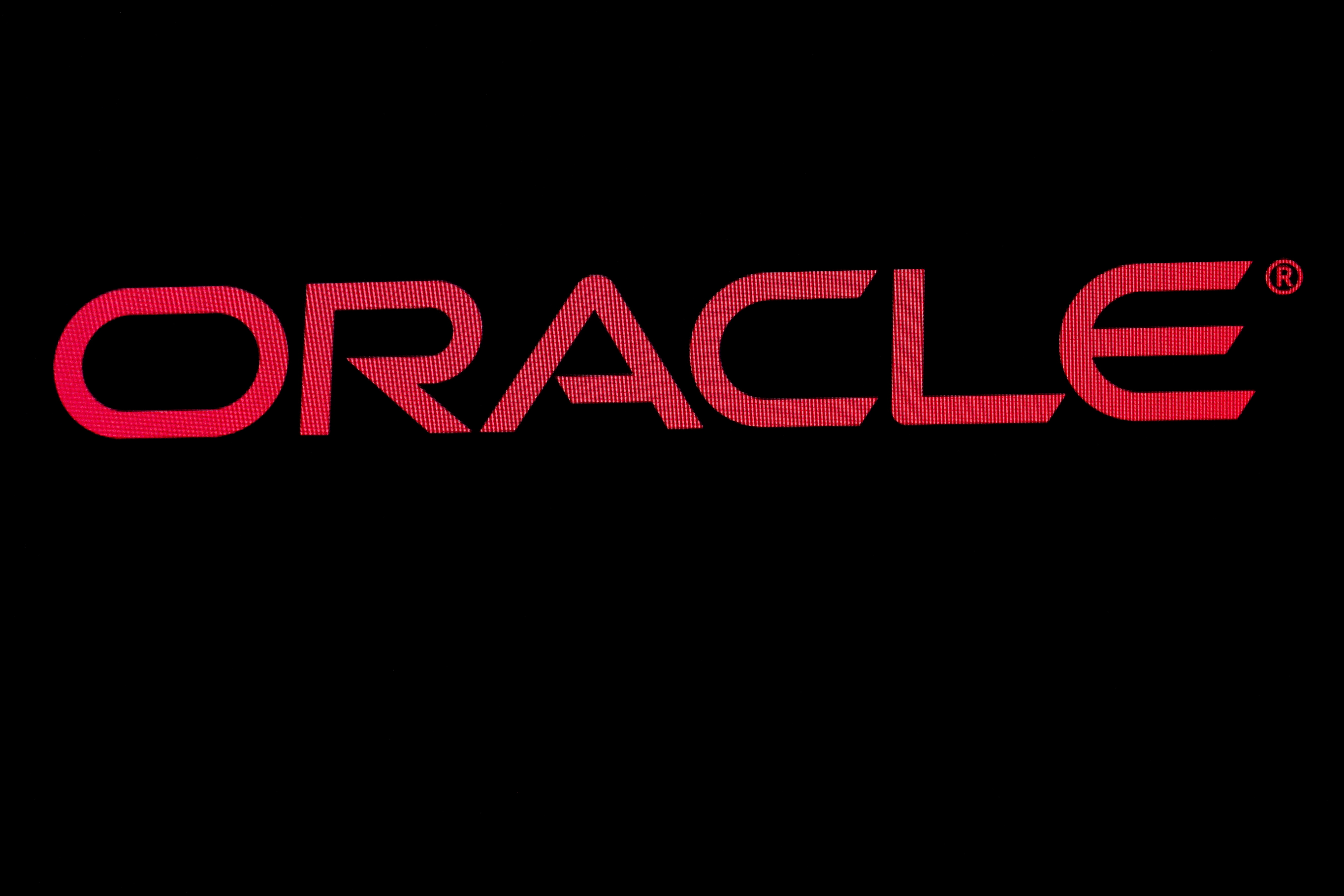 The company logo for Oracle Corp. is displayed on a screen on the floor at the NYSE in New York