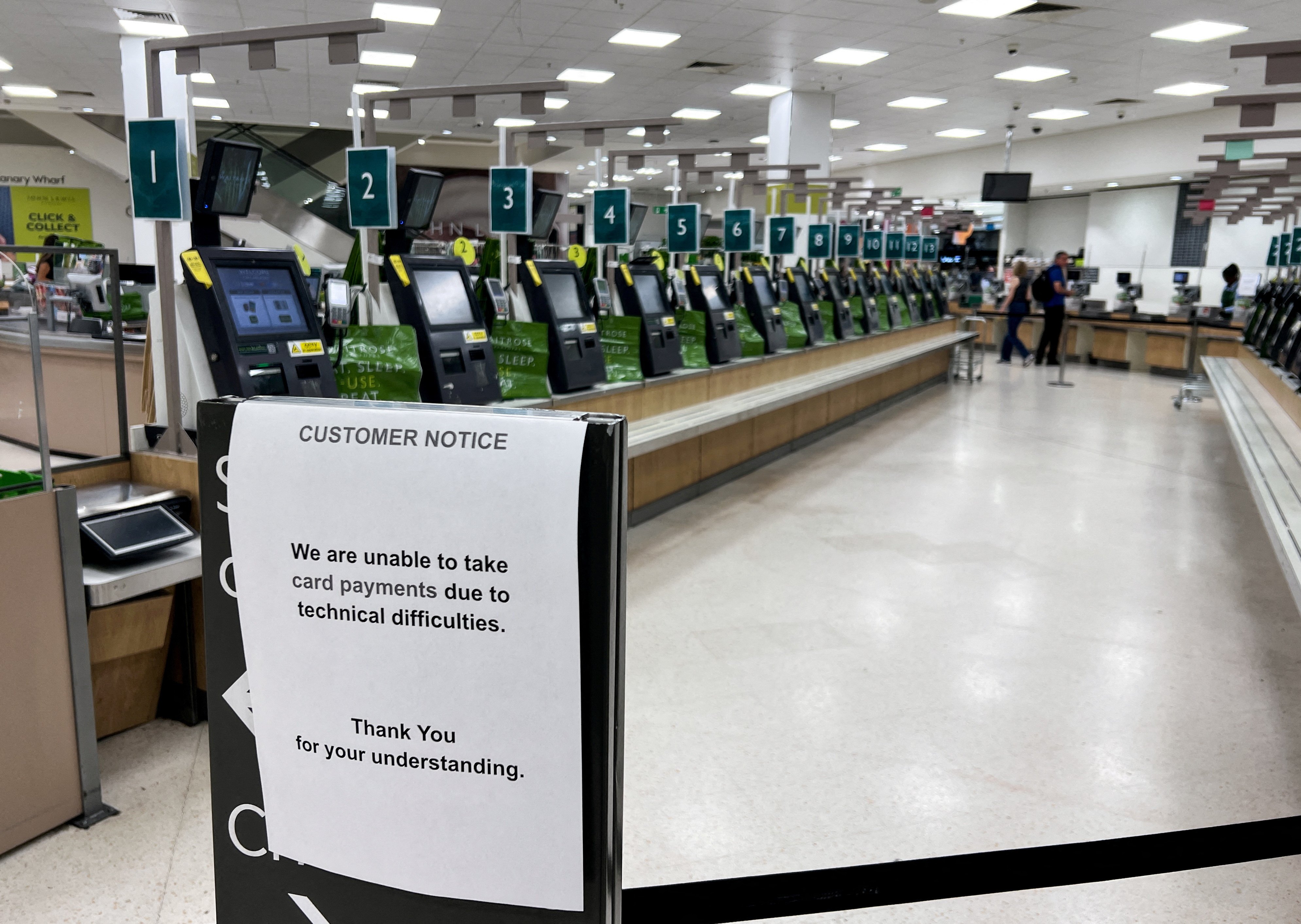 Technical difficulties notice is displayed, amid global IT outage, at supermarket in London