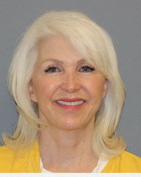 Tina Peters, the Mesa County, Colorado, clerk indicted on multiple felony counts stemming from an election security breach, poses in a jail booking photograph in Grand Junction