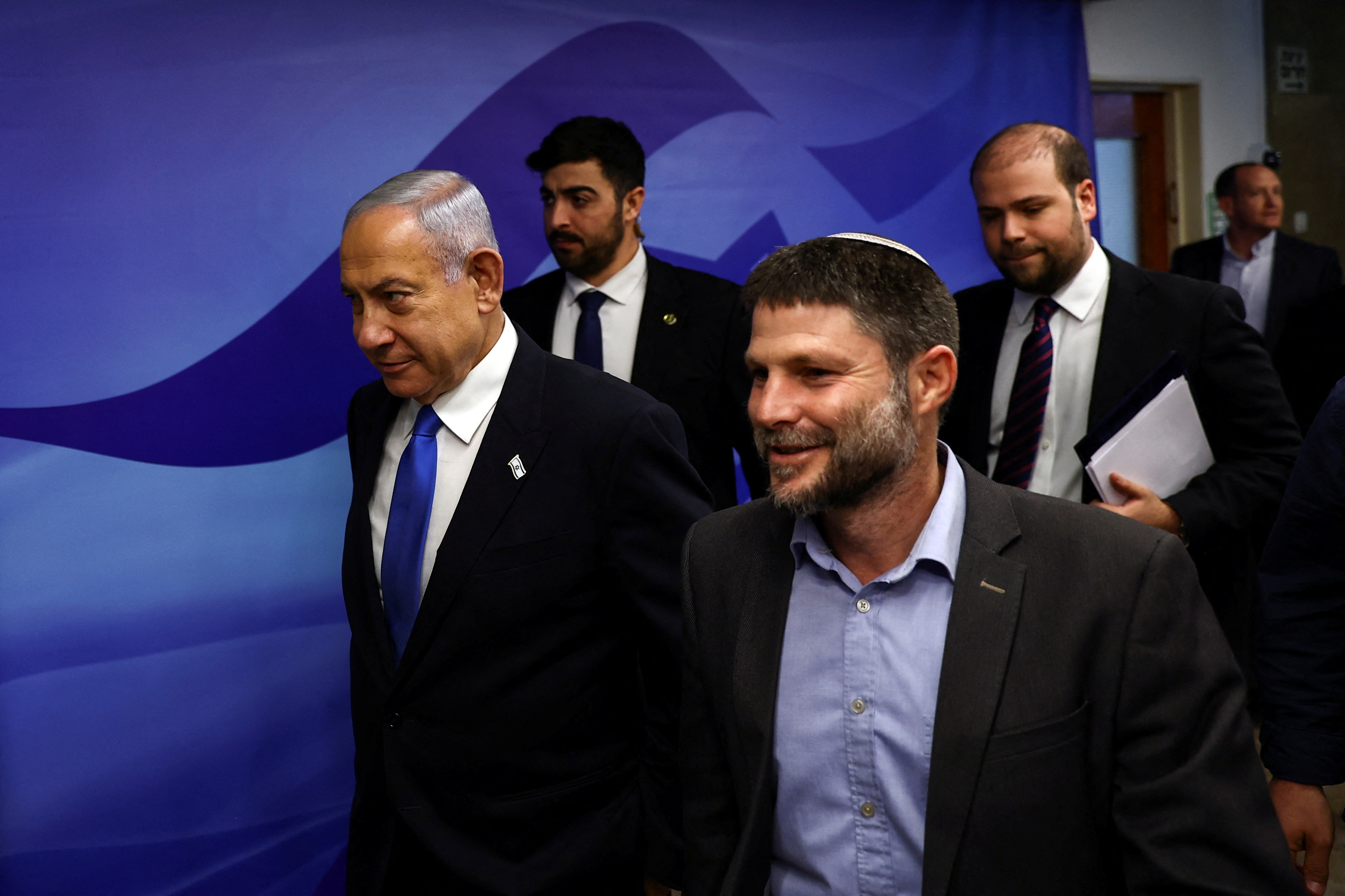 Israeli Prime Minister Benjamin Netanyahu and Finance Minister Bezalel Smotrich arrive to attend a cabinet meeting at the Prime Minister's office in Jerusalem