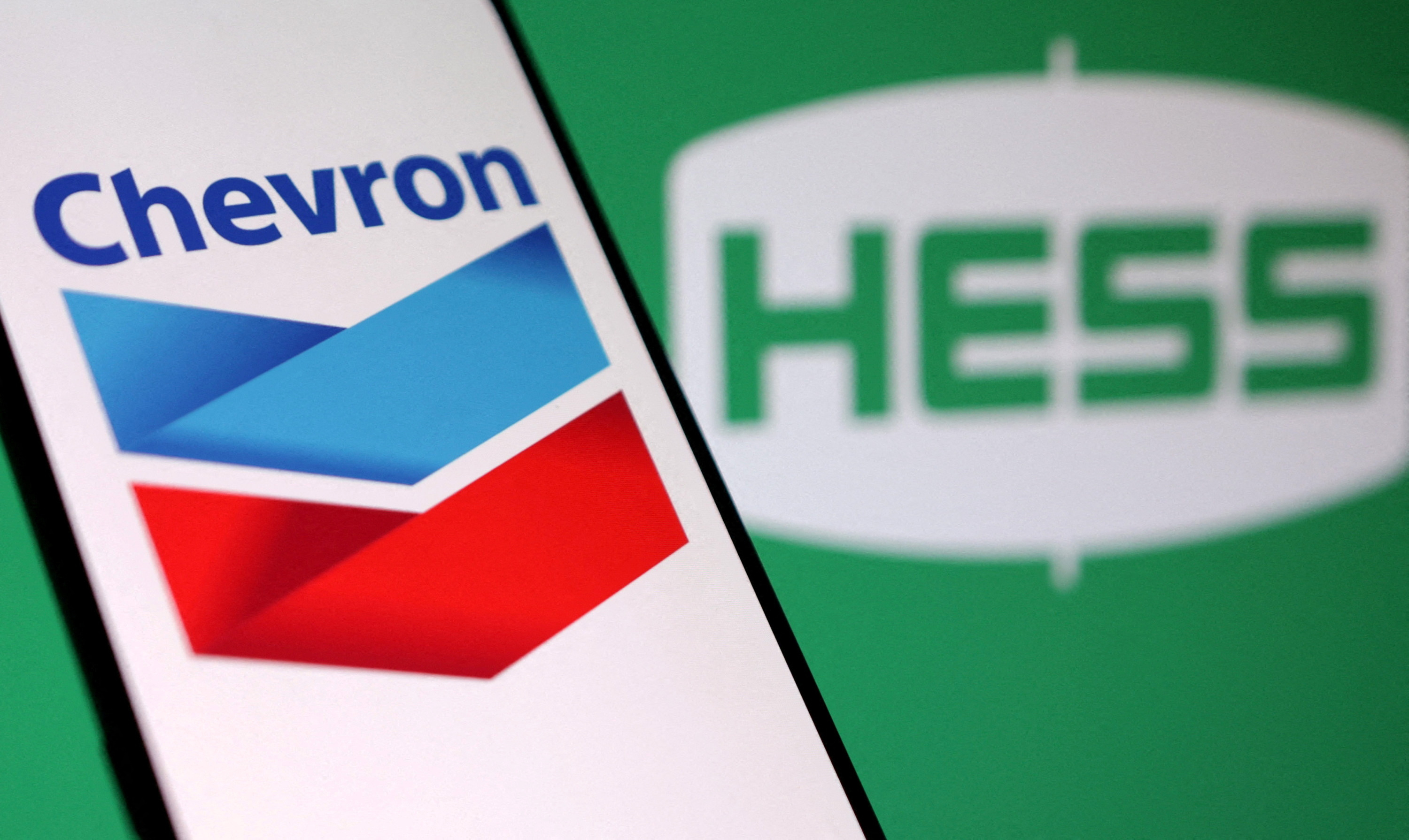 Illustration shows Chevron and Hess logos