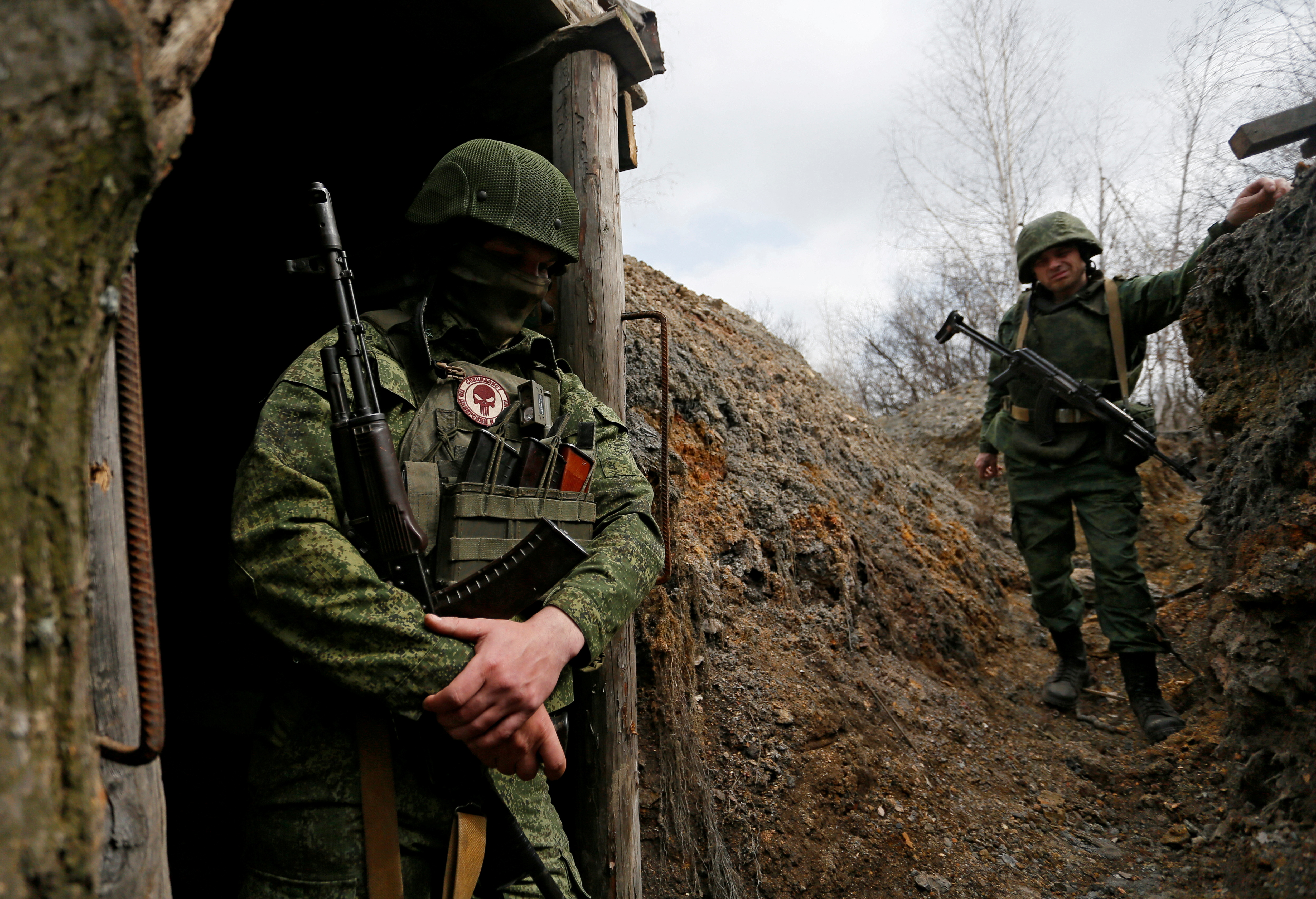 Militants of the self-proclaimed Luhansk People's Republic stand guard at frontline positions in Luhansk Region