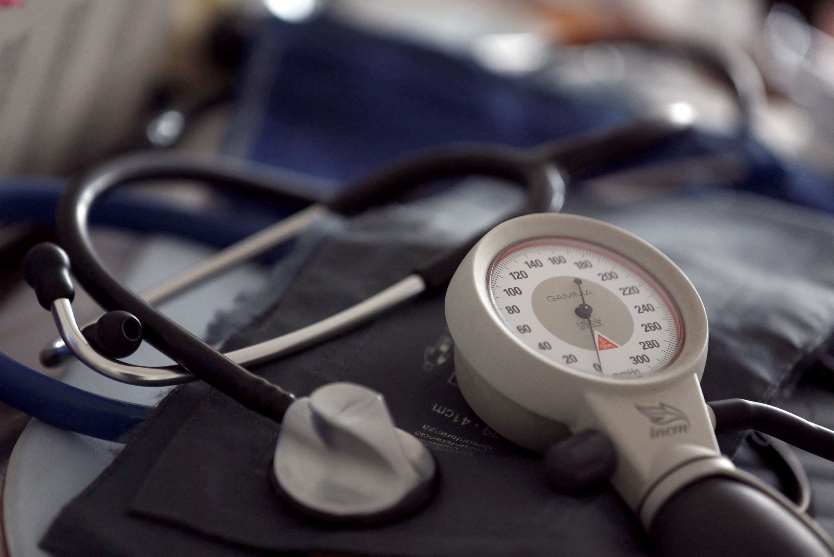 A photo illustration shows a stethoscope and  blood-pressure machine of a French general practitioner displayed in a doctor's office in Bordeaux