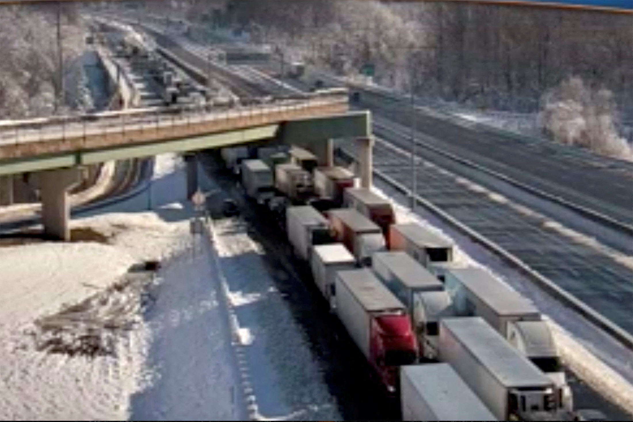 Stranded vehicles are seen in still image from highway traffic camera video as authorities worked to reopen an icy stretch of Interstate 95 closed after a storm blanketed the U.S. region in snow a day earlier, near Colchester, Virginia, U.S. January 4, 2022.  Virginia Department of Transportation/Handout via REUTERS