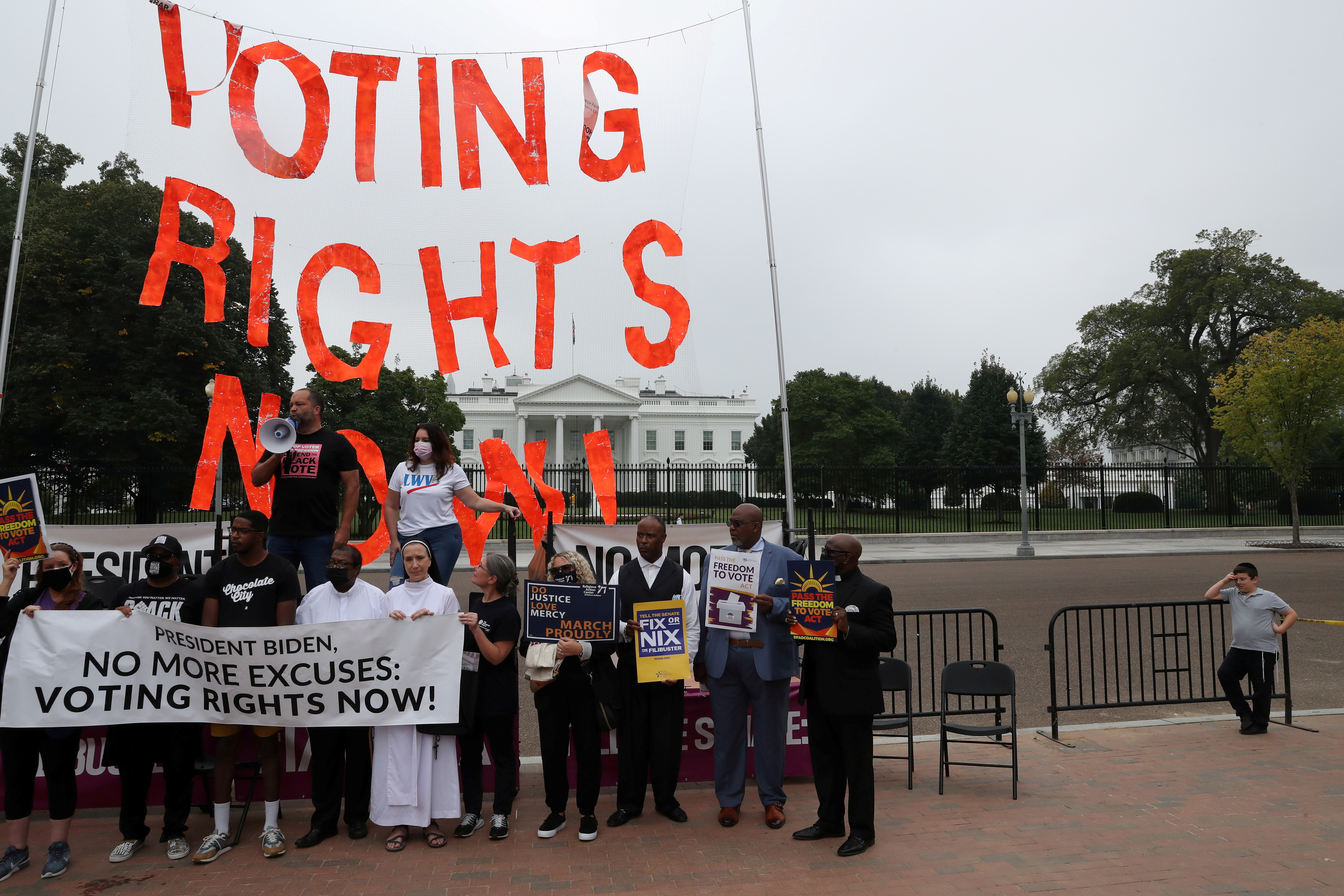 People protest for voting rights in Lafayette Park outside of the White House in Washington, U.S., October 5, 2021. REUTERS/Leah Millis