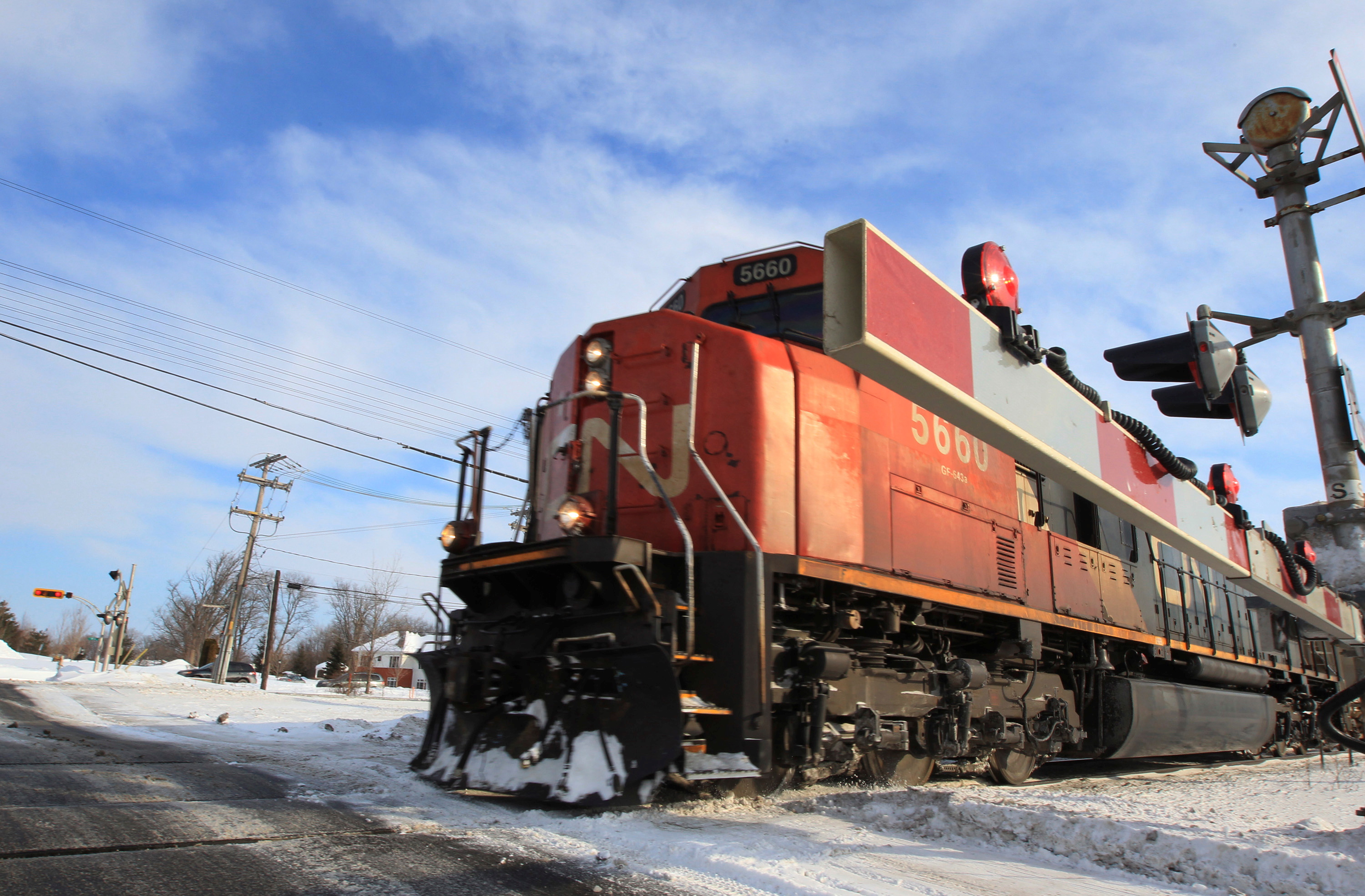 A Canadian National Railway train travels westward on a track in Montreal