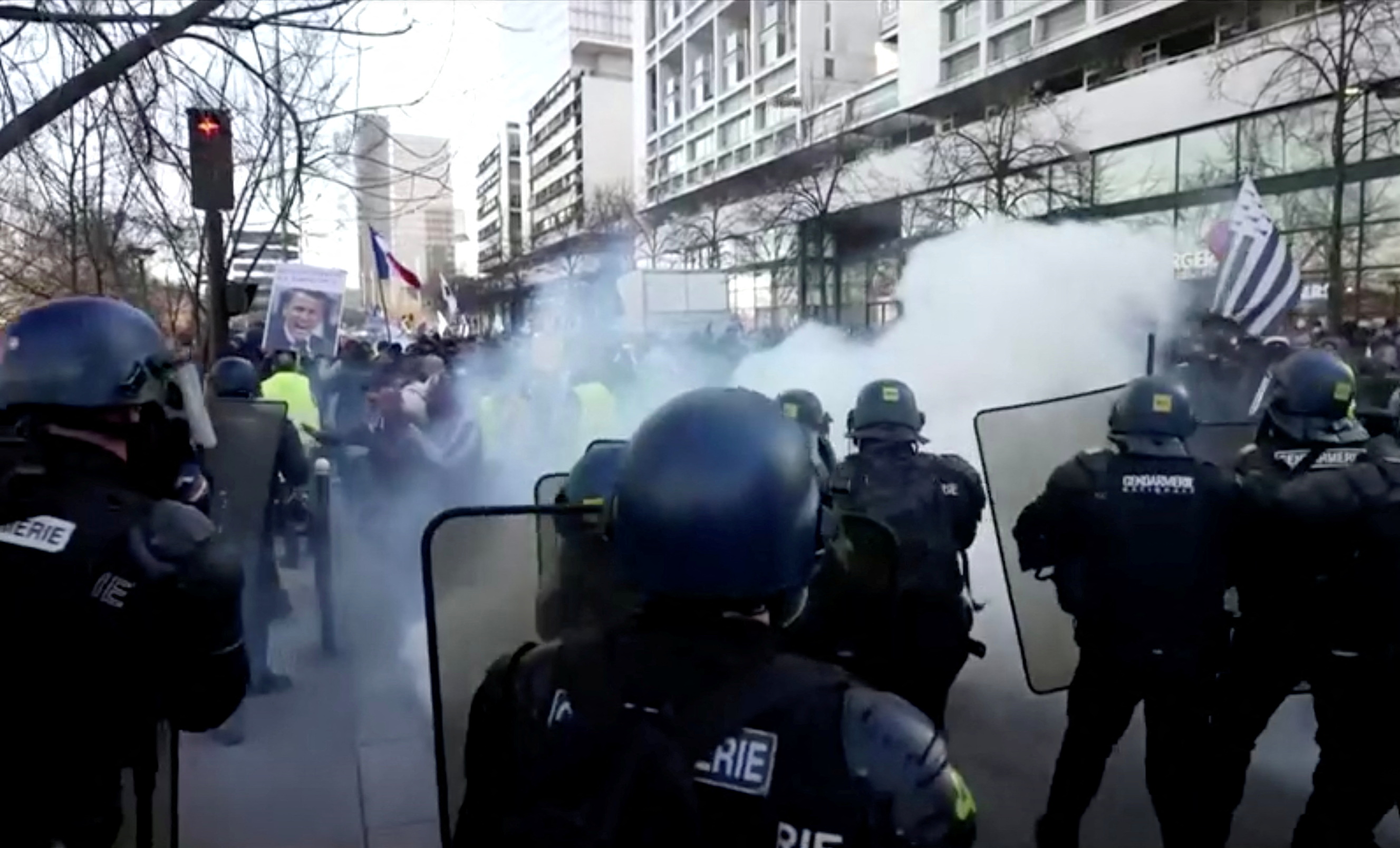 French police face demonstrators during a 