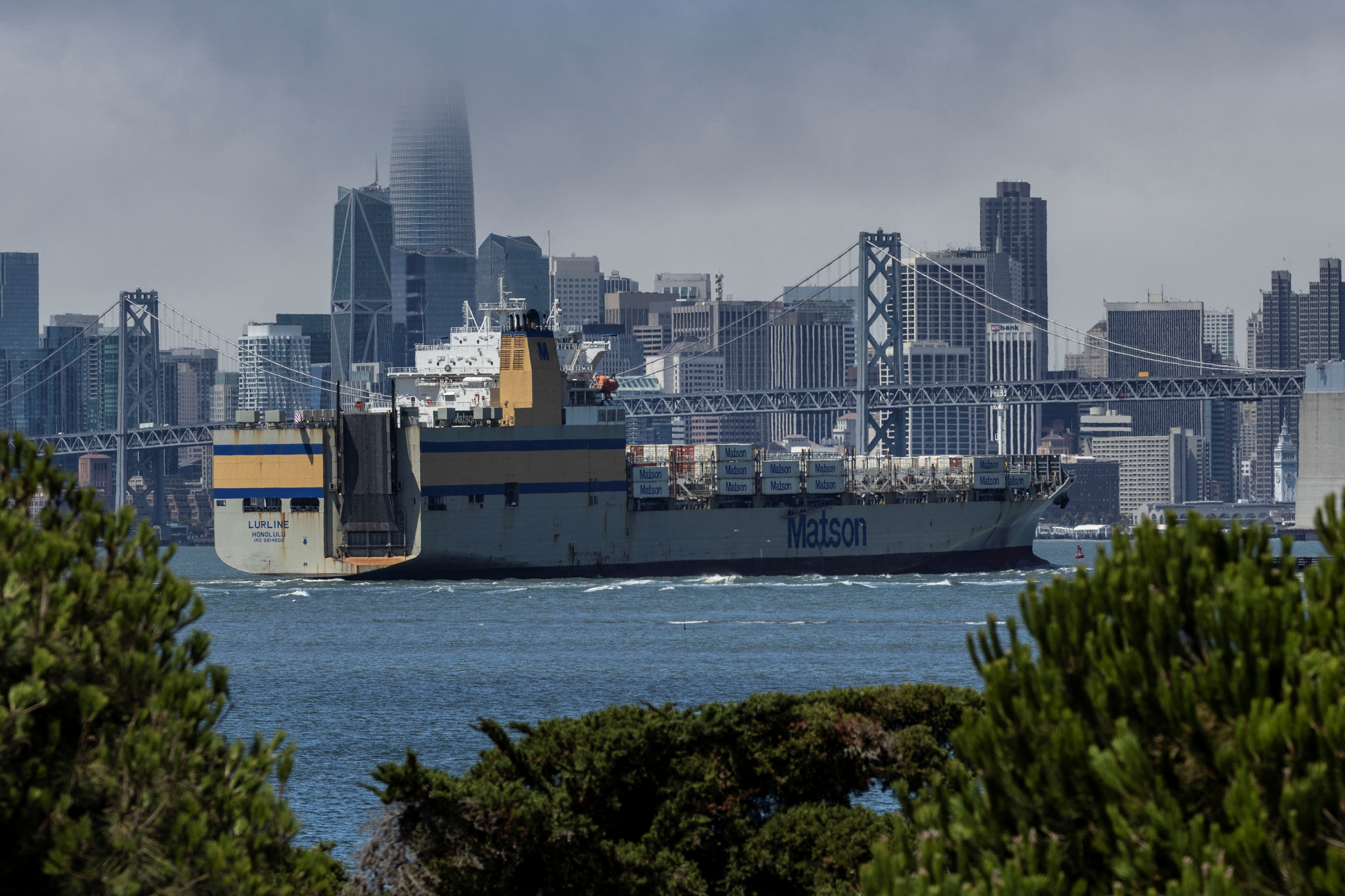A container ship is seen leaving the Port of Oakland, California