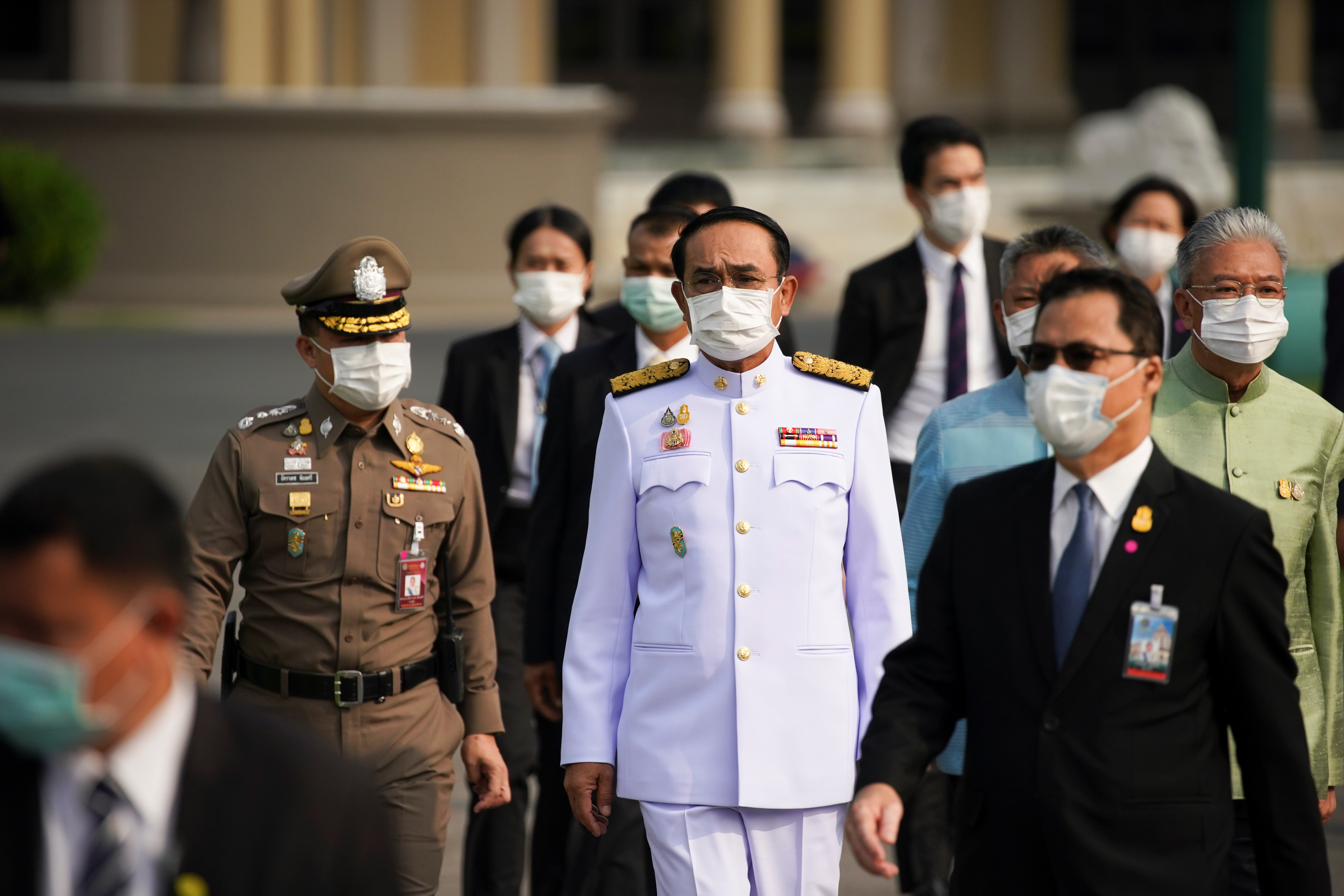 Thailand's Prime Minister Prayuth Chan-ocha arrives before a family photo session with new cabinet ministers at the Government House in Bangkok