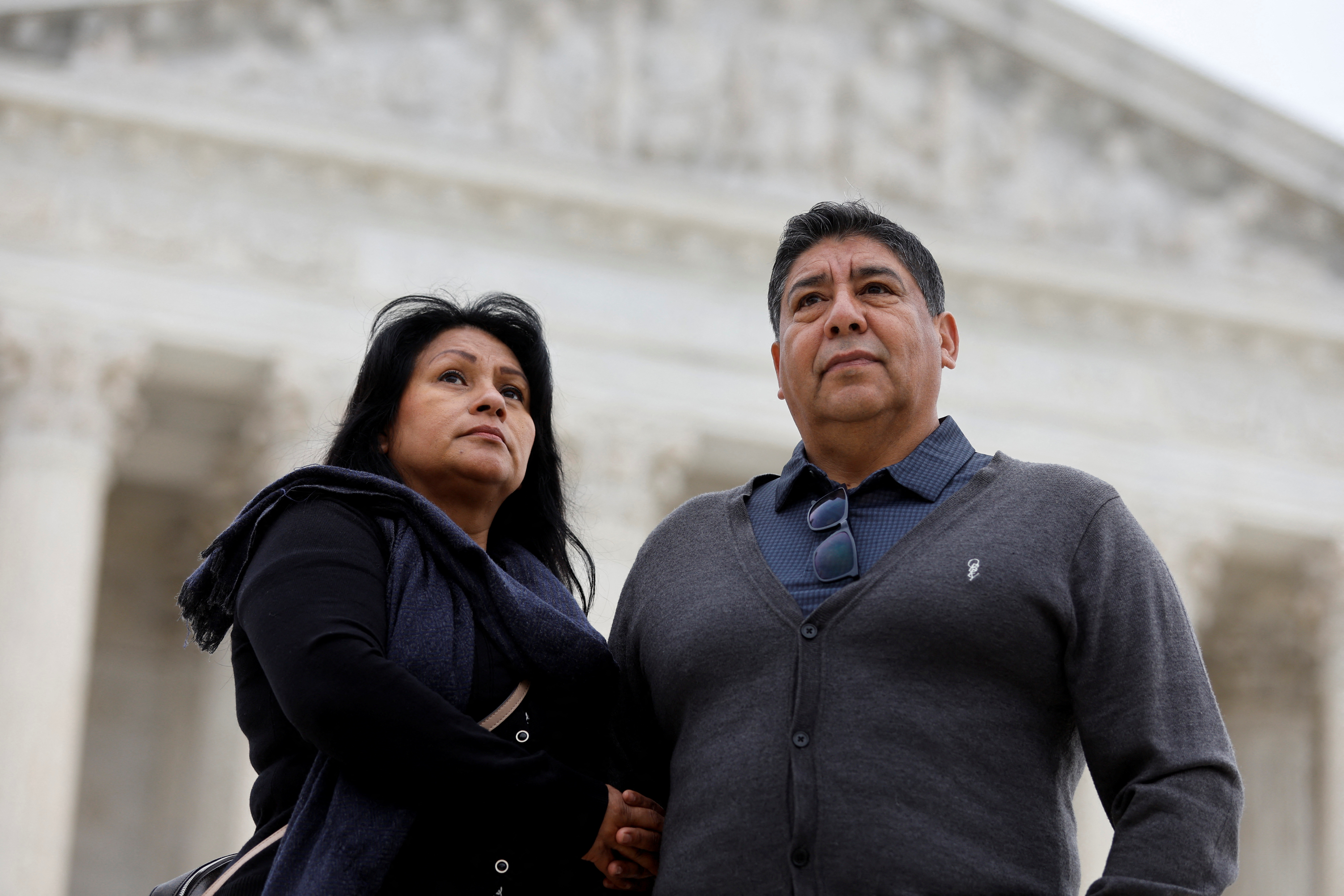 Beatrice Gonzalez and Jose Hernandez, whose child was fatally shot and killed in a 2015 rampage in Paris, are seen outside the U.S. Supreme Court in Washington
