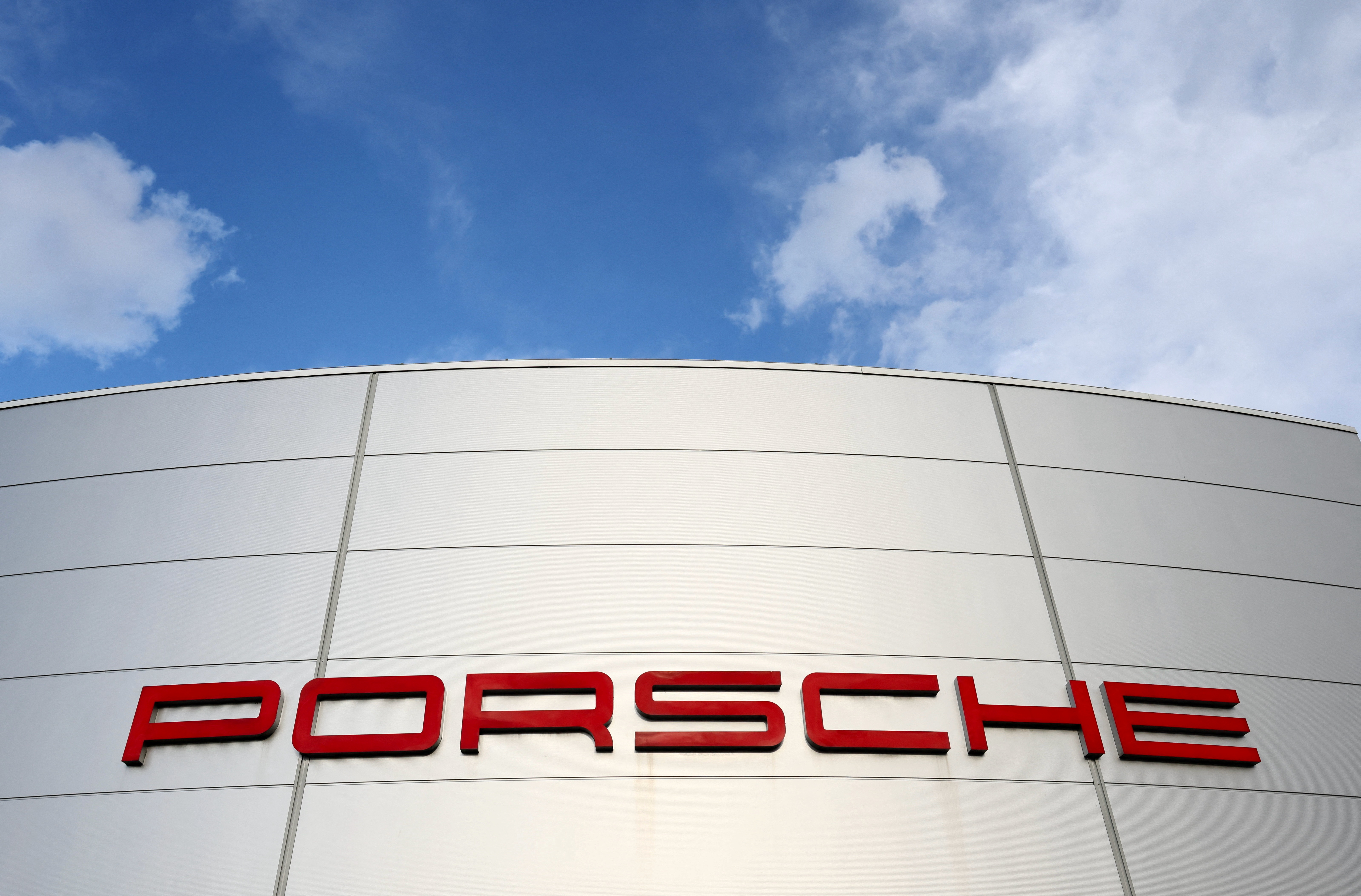 A logo of Porsche is seen outside a Porsche car dealer in Brussels