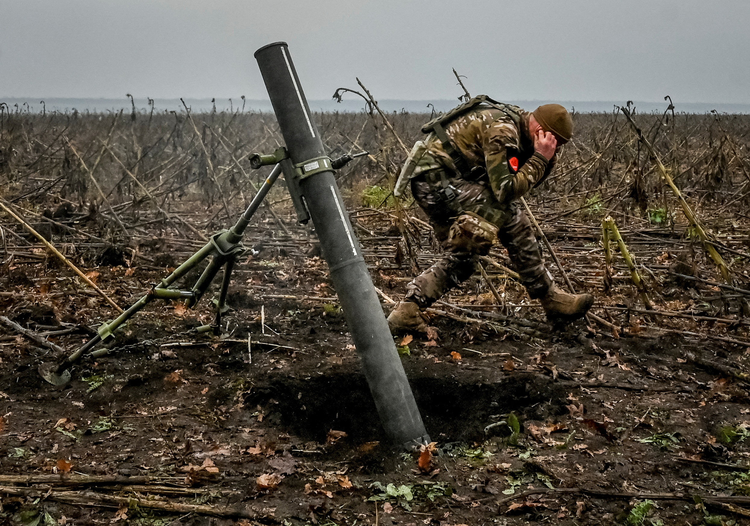 Ukrainian servicemen fire a mortar on a front line in Zaporizhzhia region